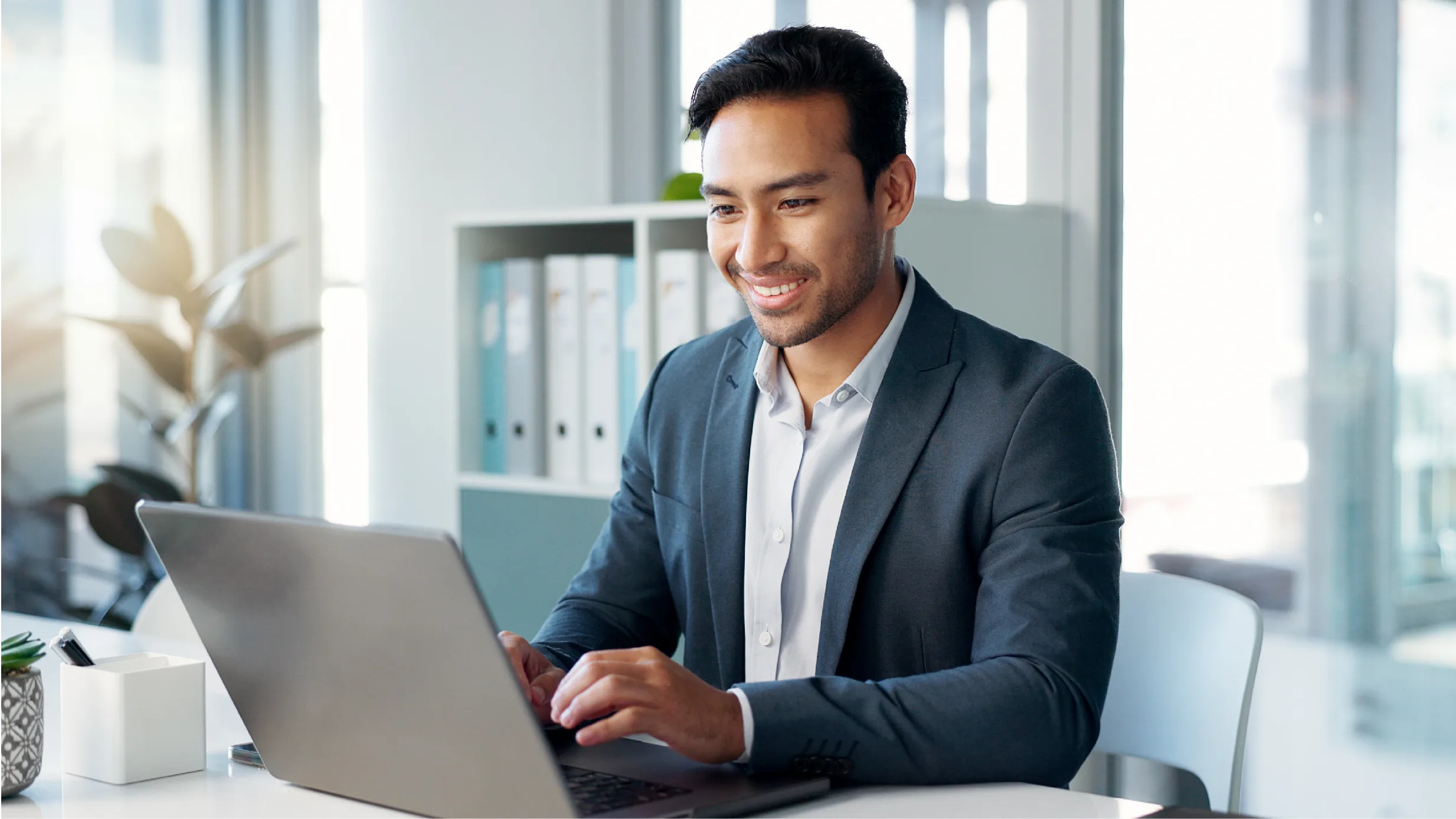 man typing on a computer