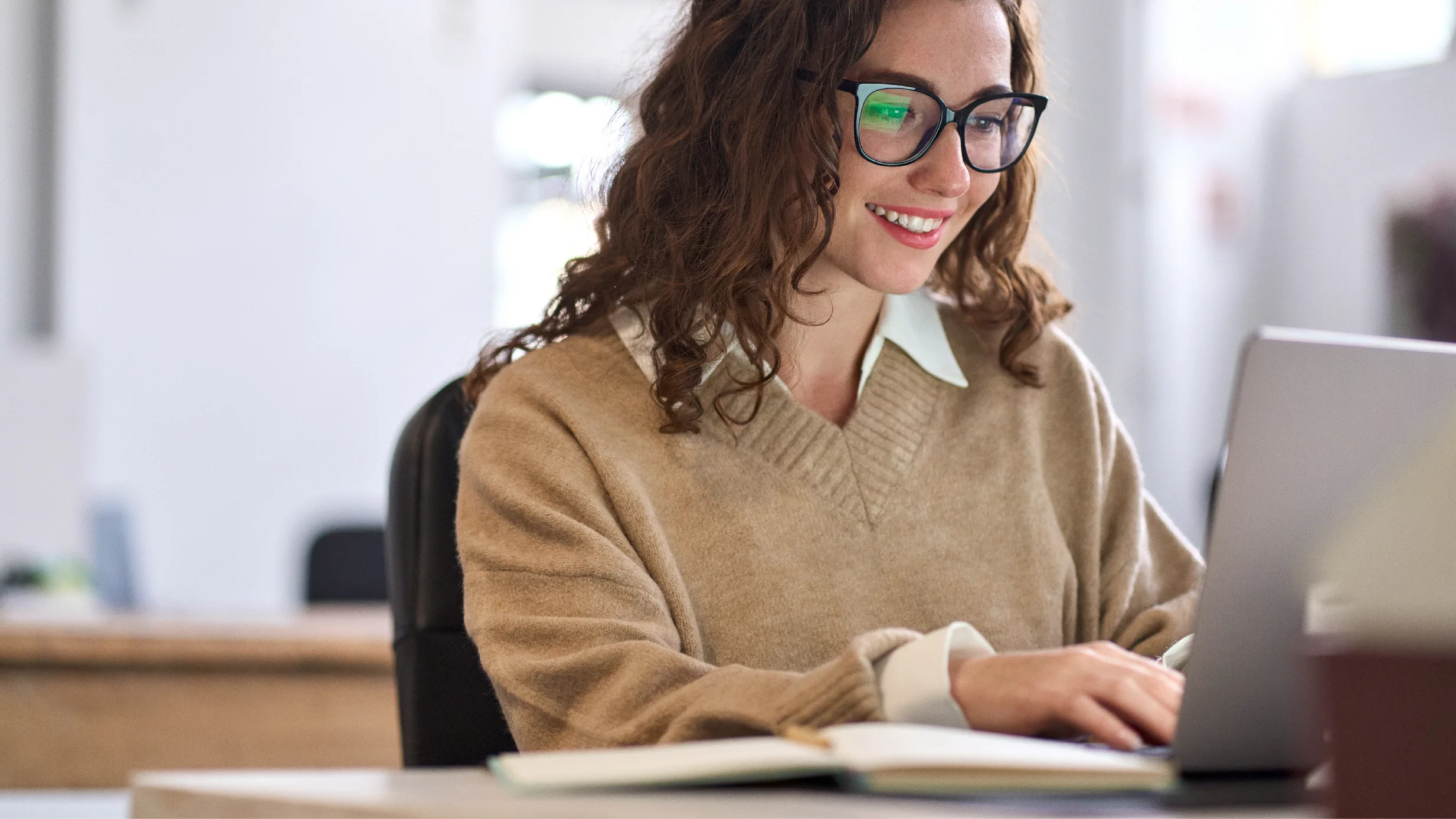 woman typing on a computer
