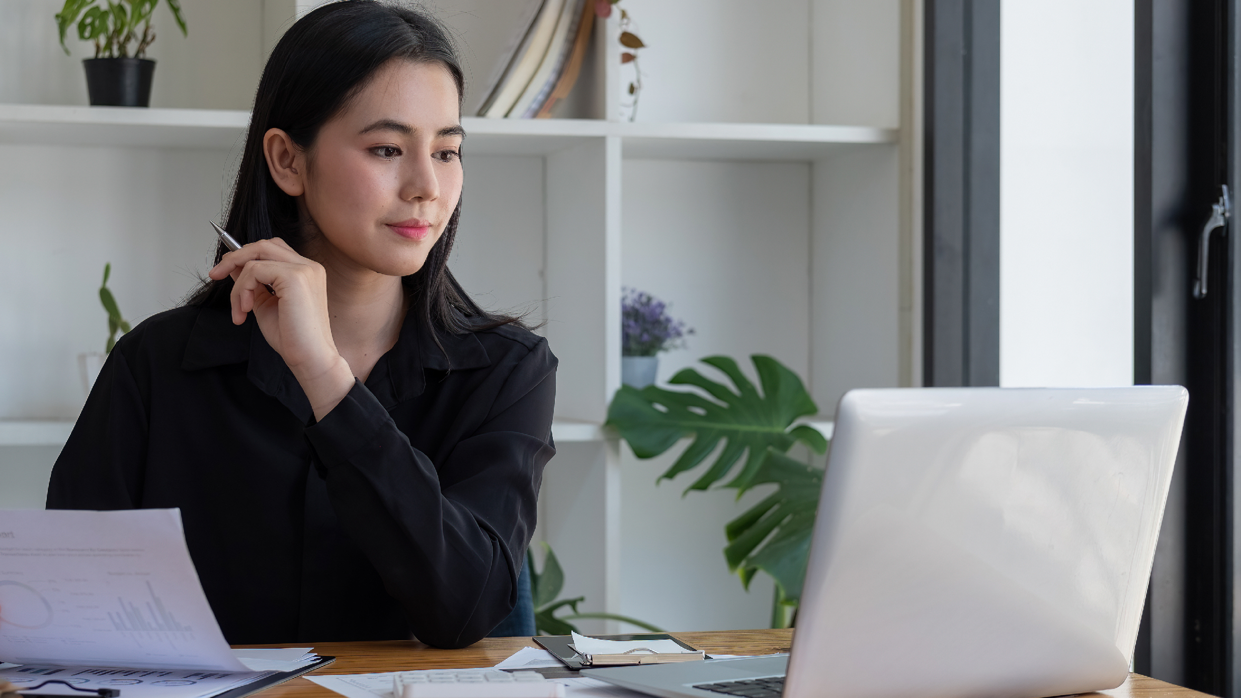 woman looking at a computer screen