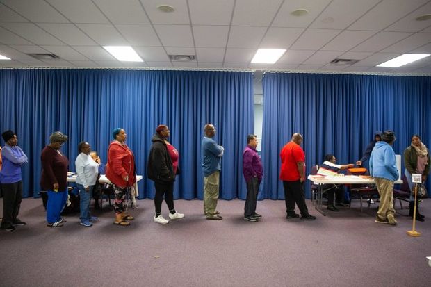 Voters wait in line in 2018