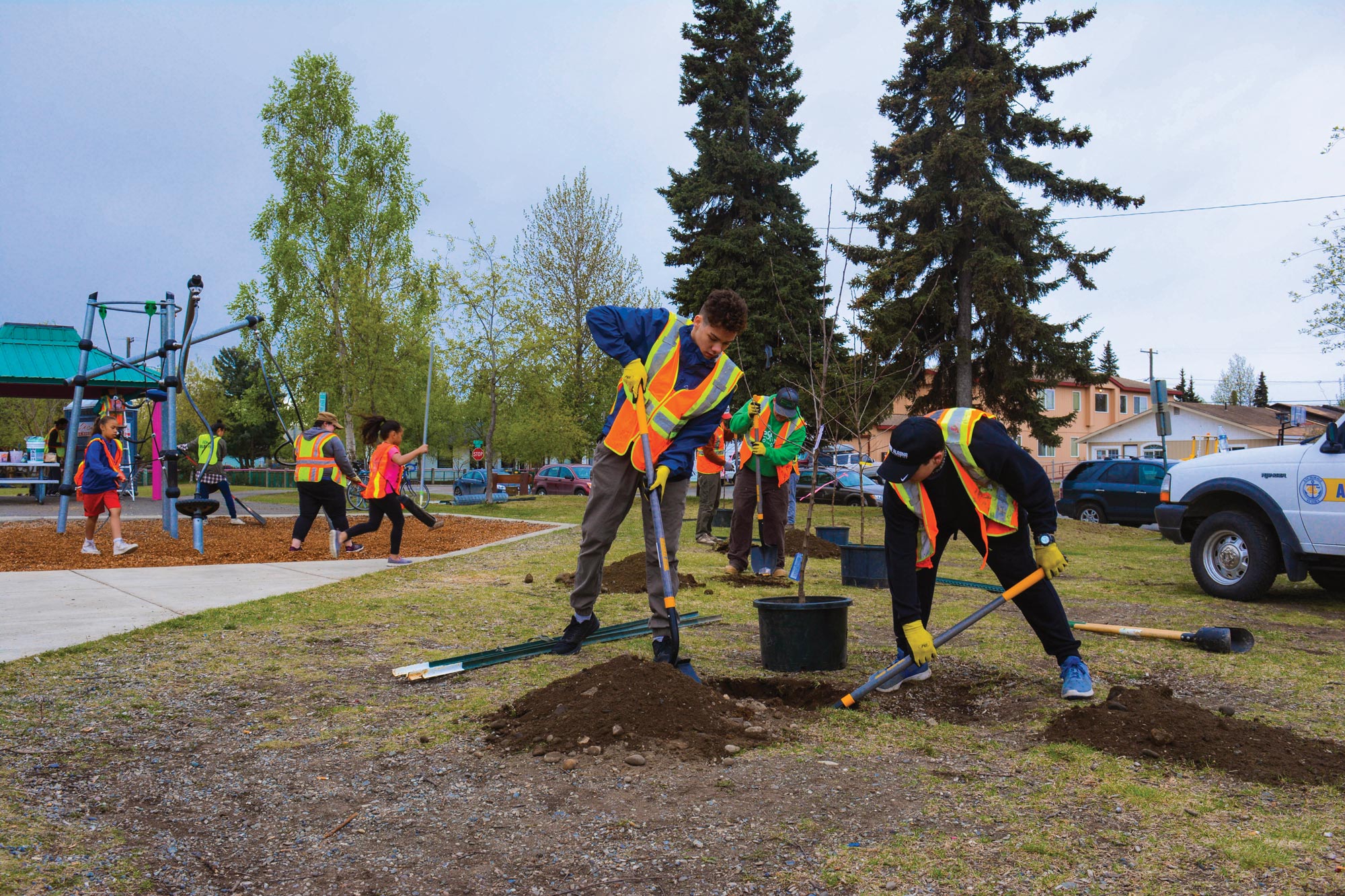 Volunteers in Anchorage, Alaska, plant trees at the Fairview Park Fix-It as part of the Cities of Service Resilience AmeriCorps program.
