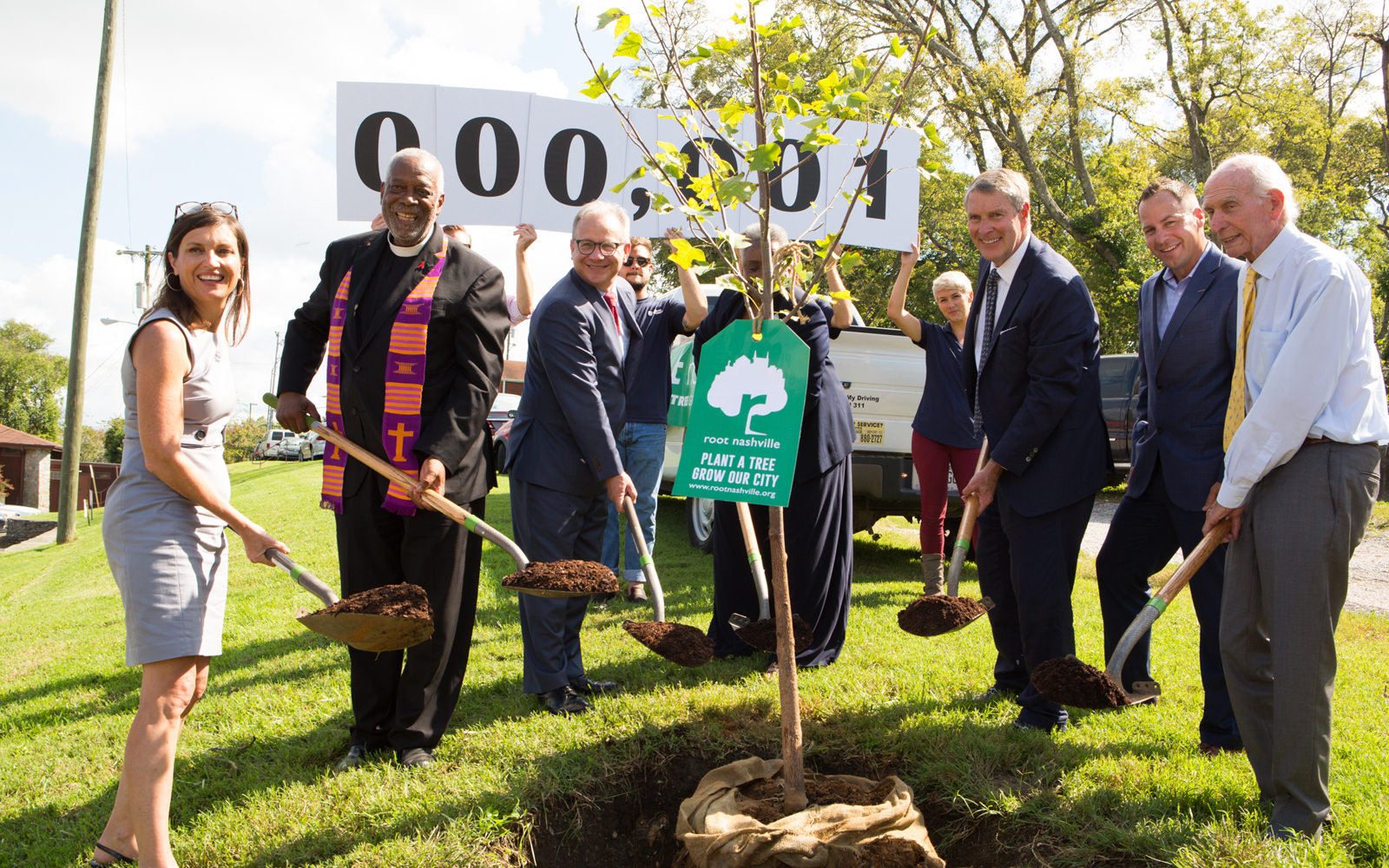 Mayor David Briley of Nashville, Tennessee, (third from left) joins other community leaders in planting the first tree to launch Root Nashville.