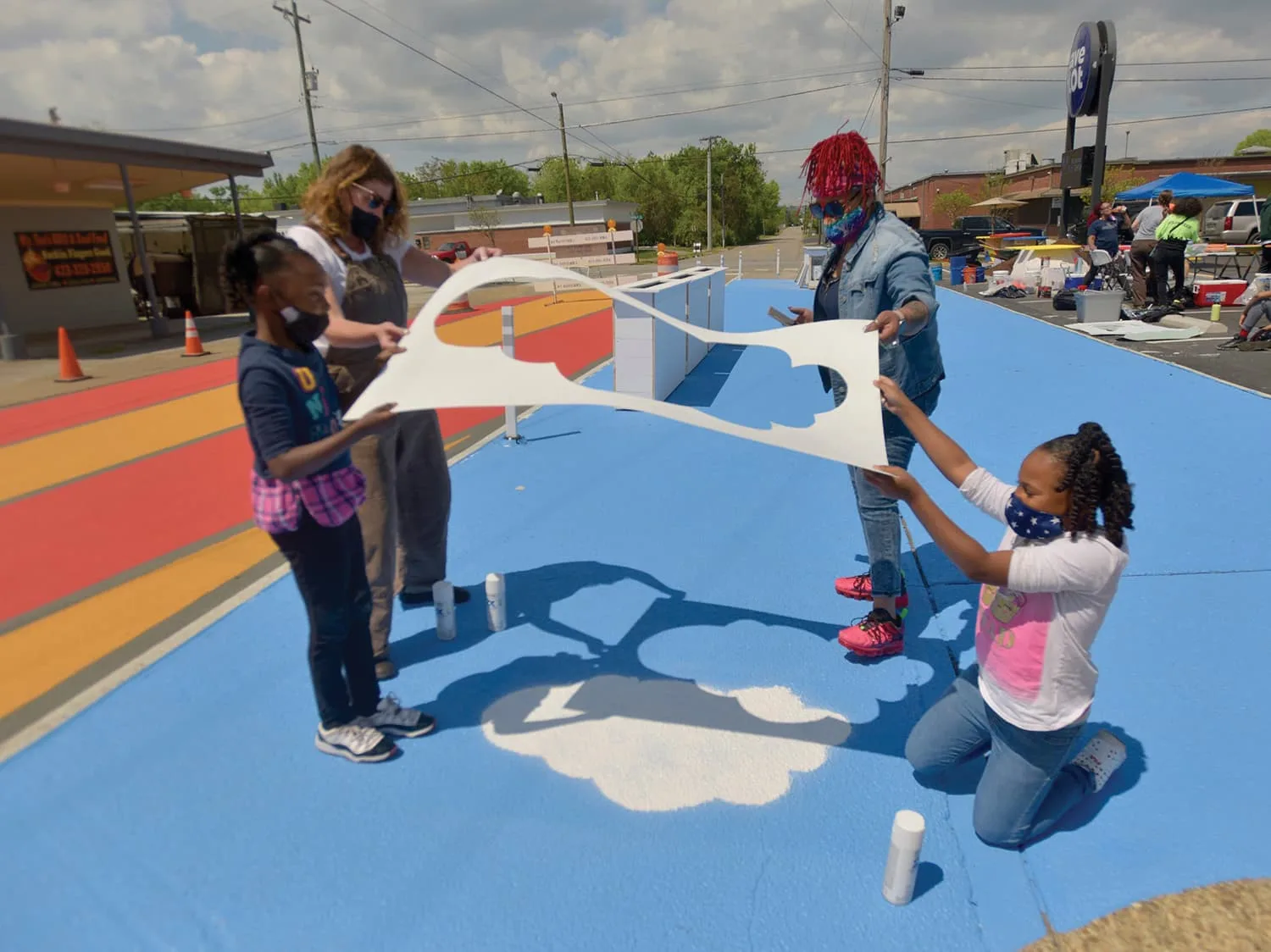 Team hardworking during Asphalt Art paintings