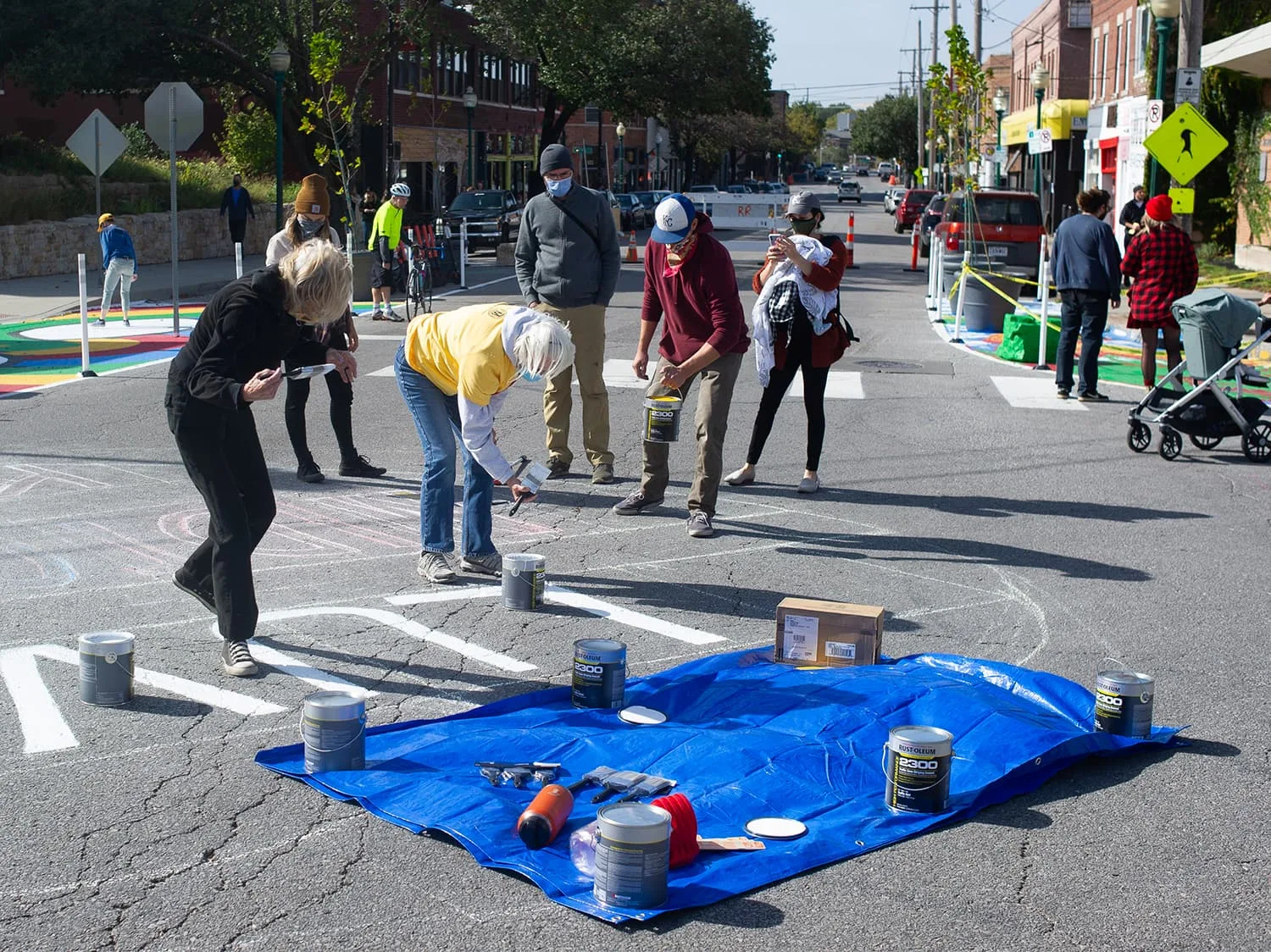 Asphalt art team started painting the intersection