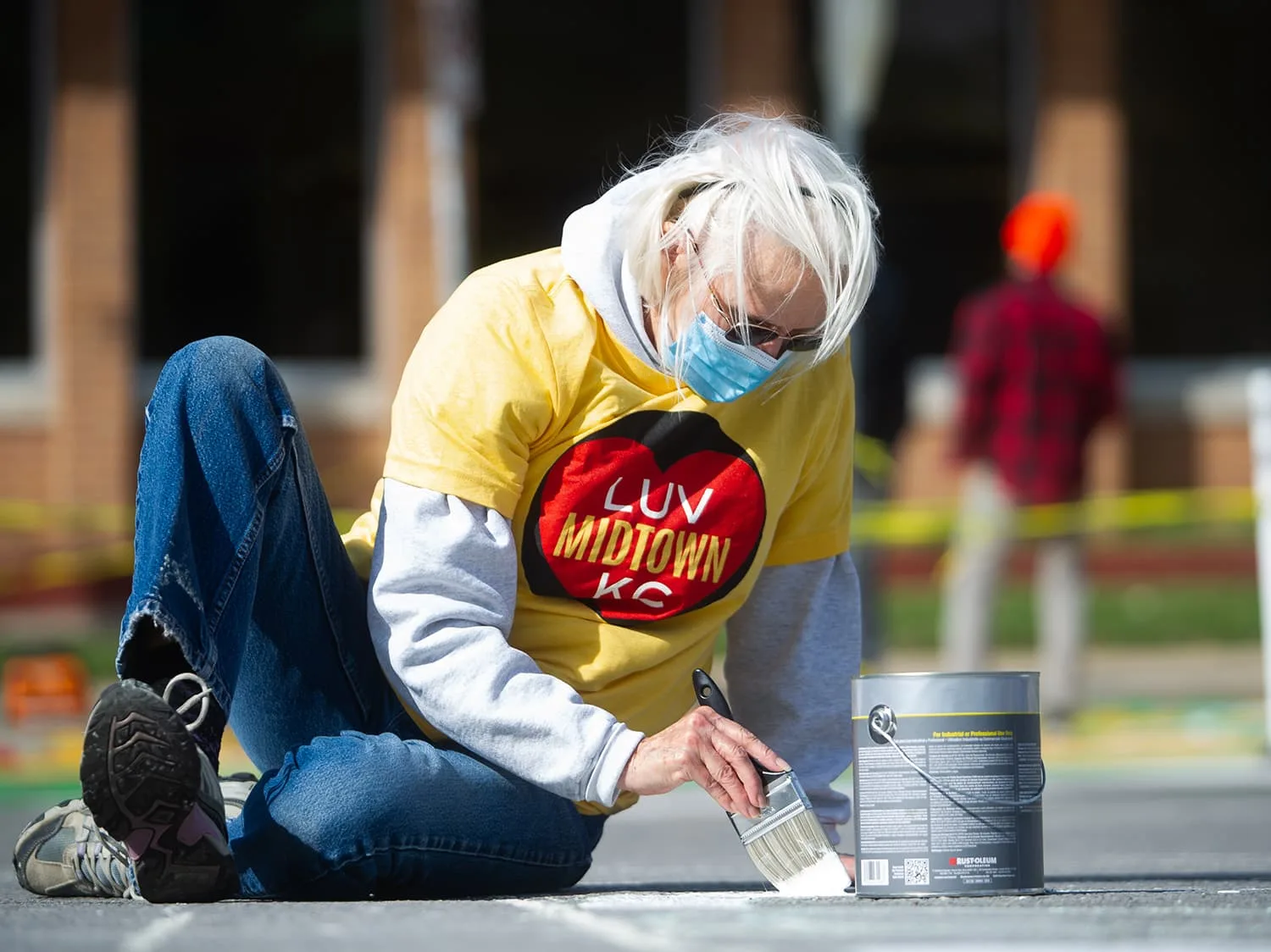 Person with the mask focused in painting