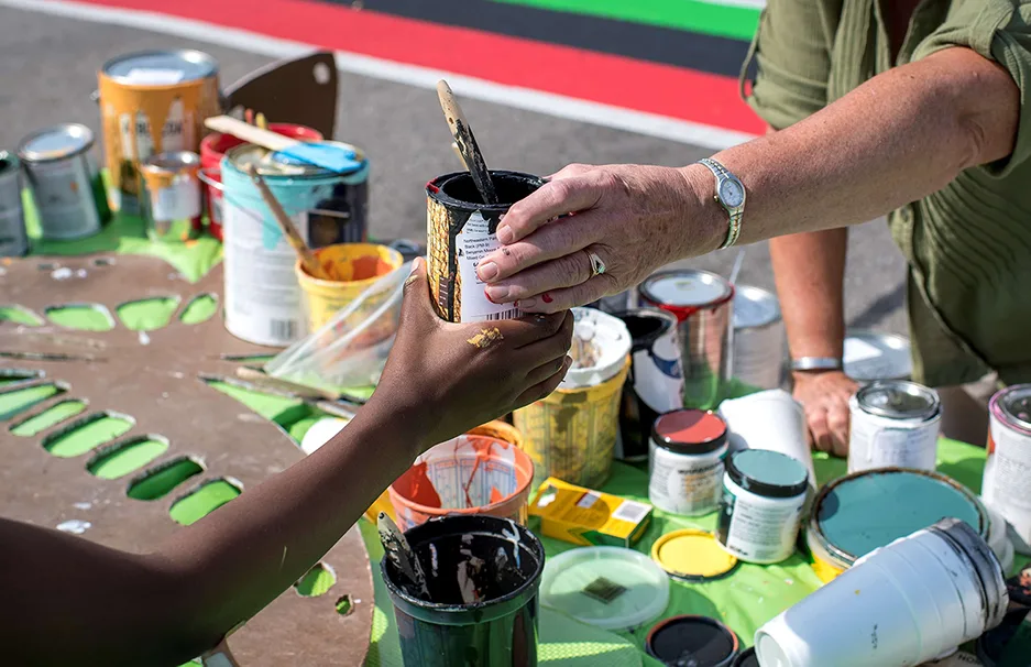 Asphalt Art choosing paint type in Saginaw, Michigan