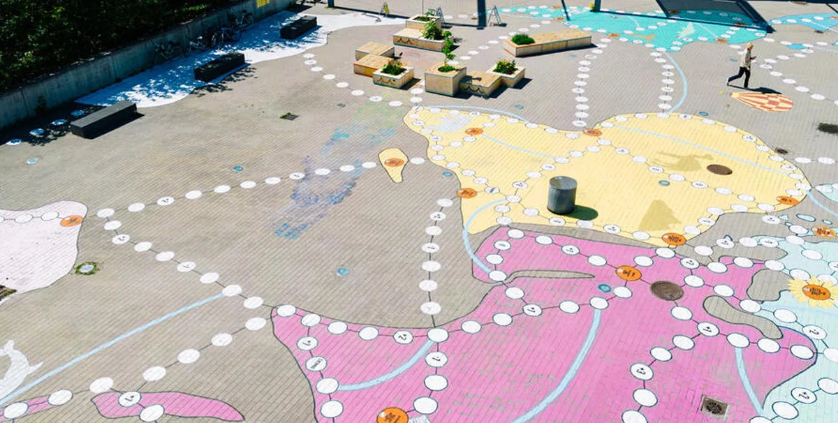 Activating a neighborhood plaza with an artful game - Helsinki, Finland