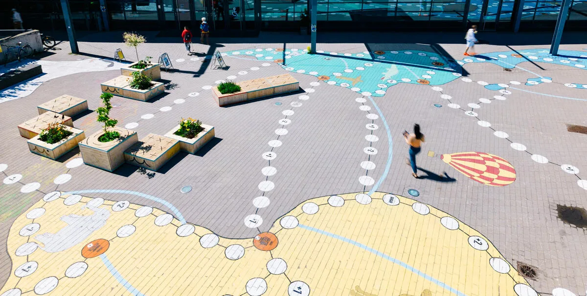 Activating a neighborhood plaza with an artful game - Helsinki, Finland