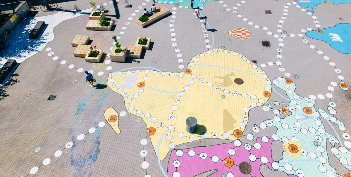Activating a neighborhood plaza with an artful game - Helsinki, Finland