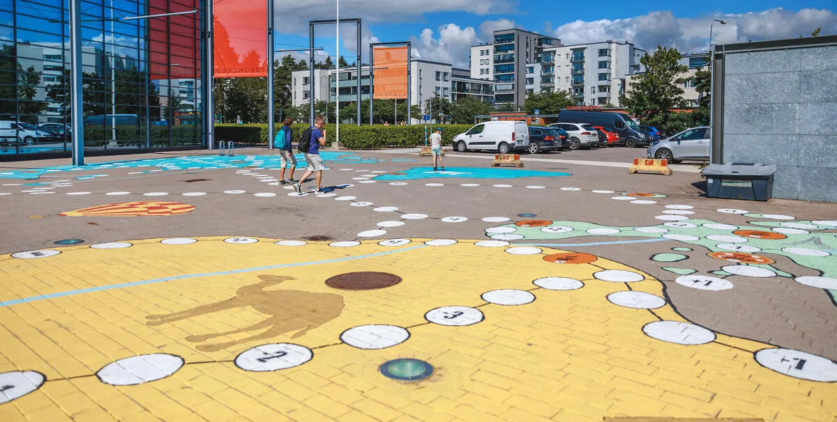 Activating a neighborhood plaza with an artful game - Helsinki, Finland