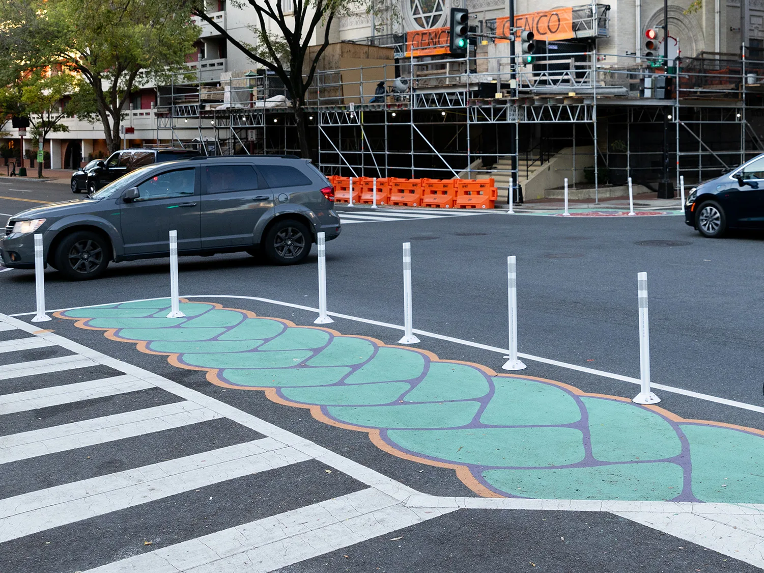 Painted crosswalk sideways with car riding on the road in DC