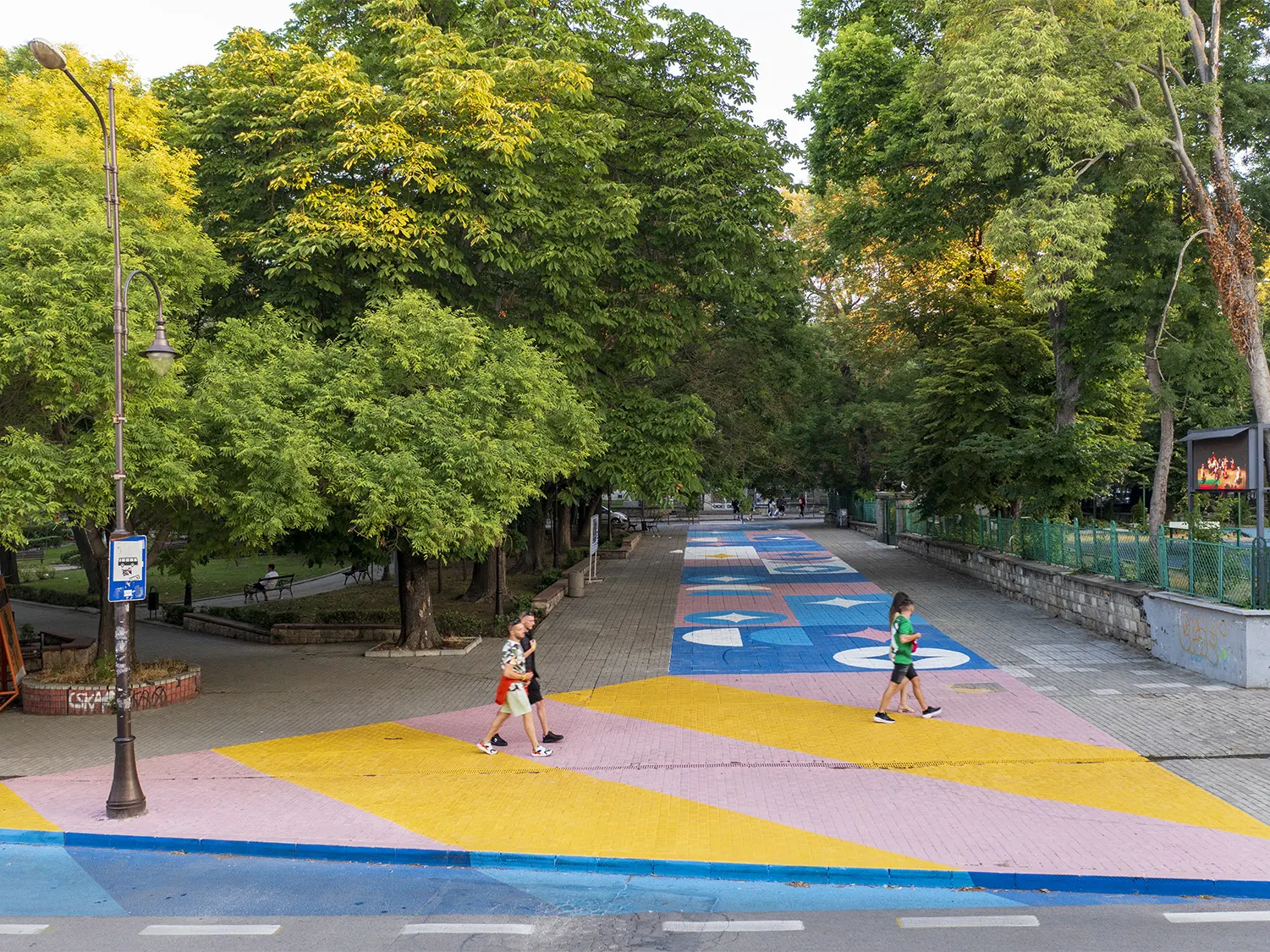 Pedestrian walking in colorful crossings of Varna