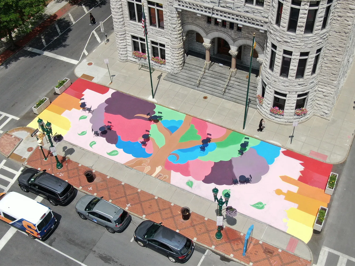 Syracuse aerial view of pedestrian crossing painted with Asphalt Art creative artwork