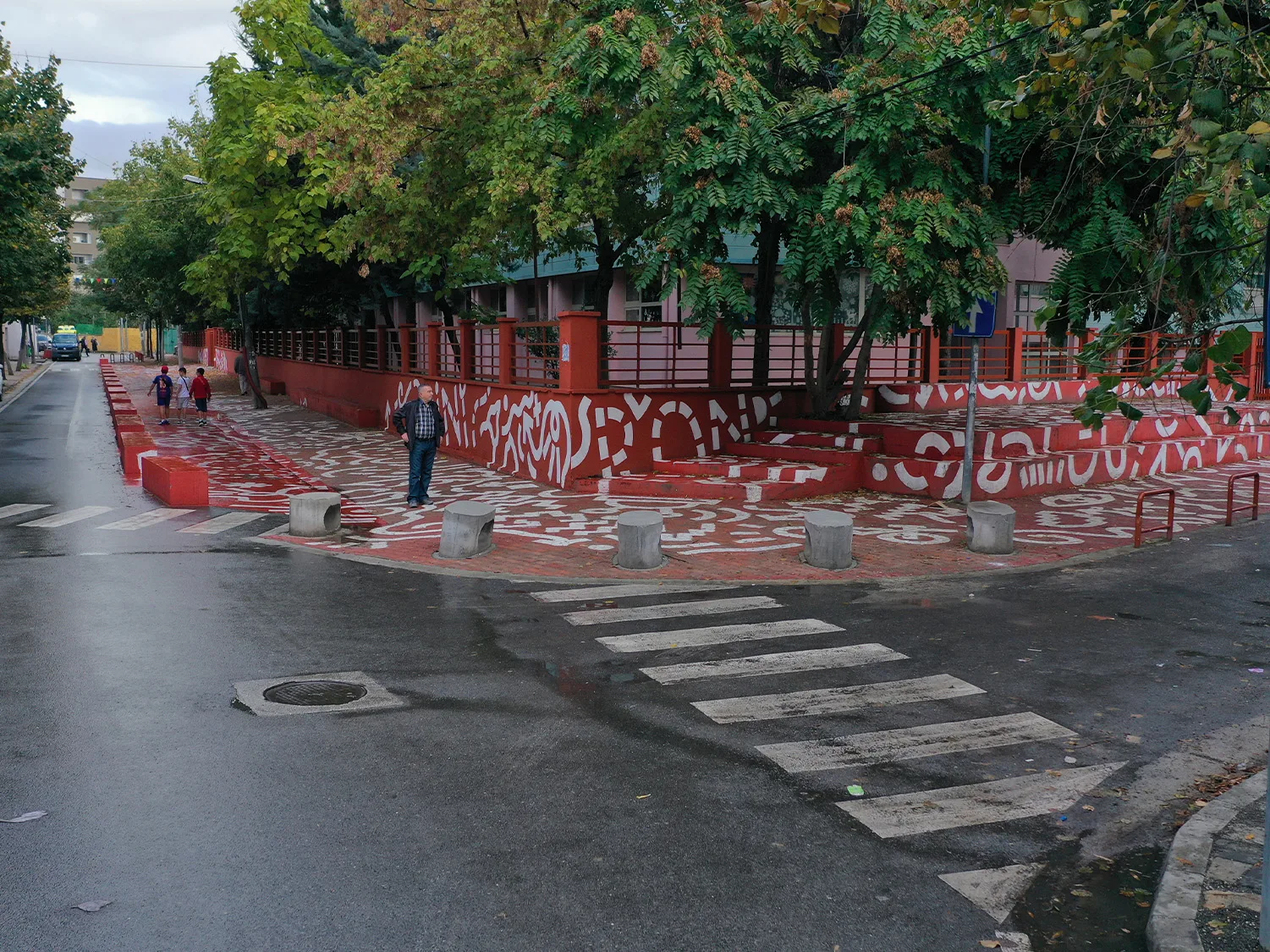 A lady walking on the school way crossing