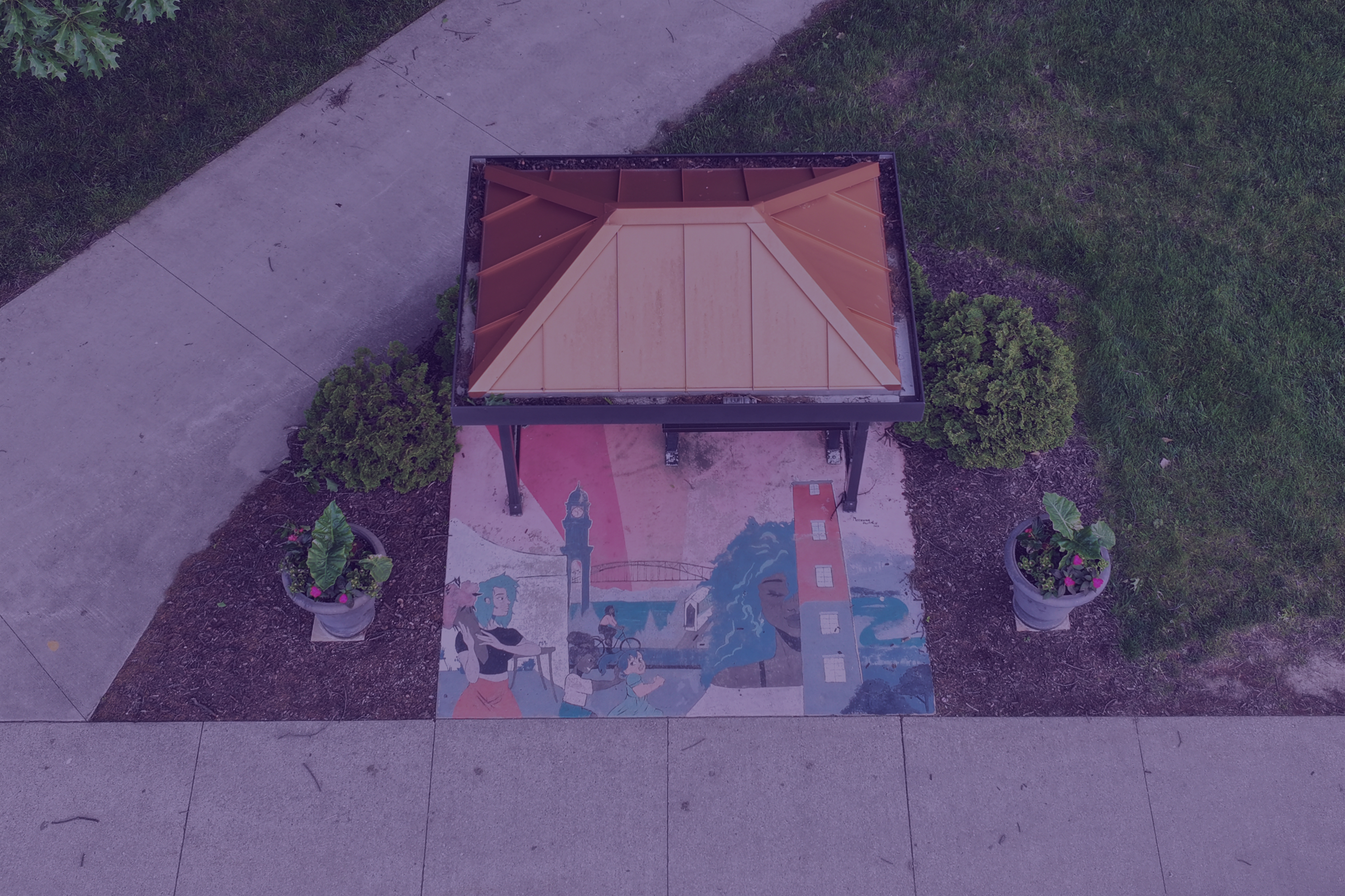 Utilizing bus shelters to promote sustainability and the arts