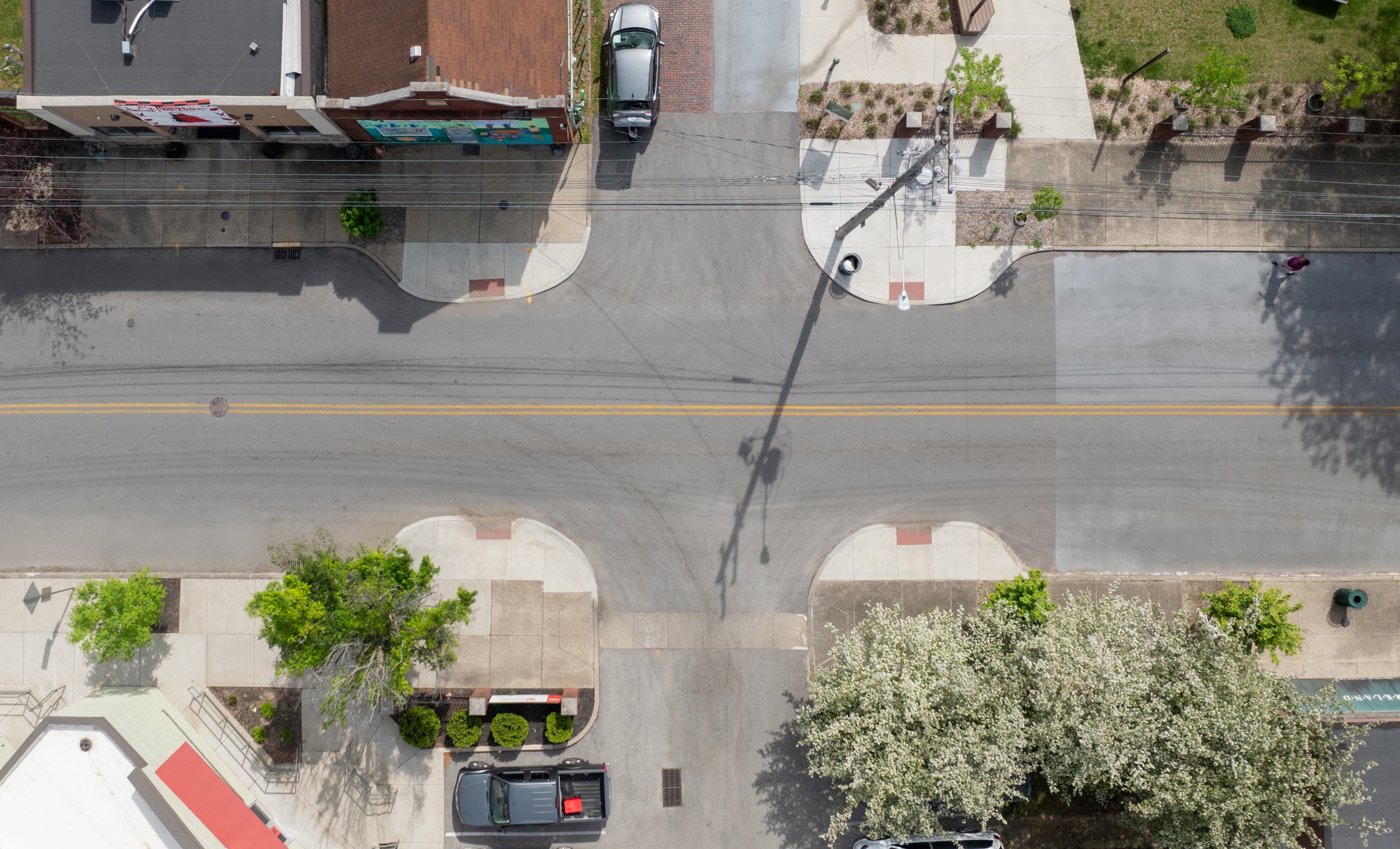 Asphalt Art Initiative before/after comparison photos of Louisville, Kentucky.