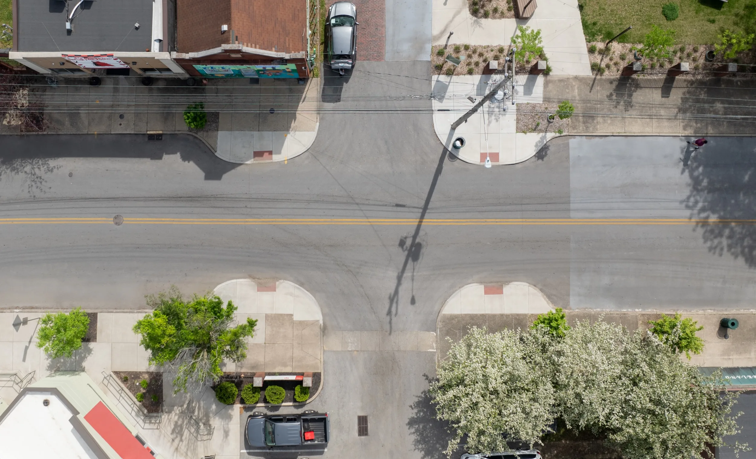 Asphalt Art Initiative before/after comparison photos of Louisville, Kentucky.