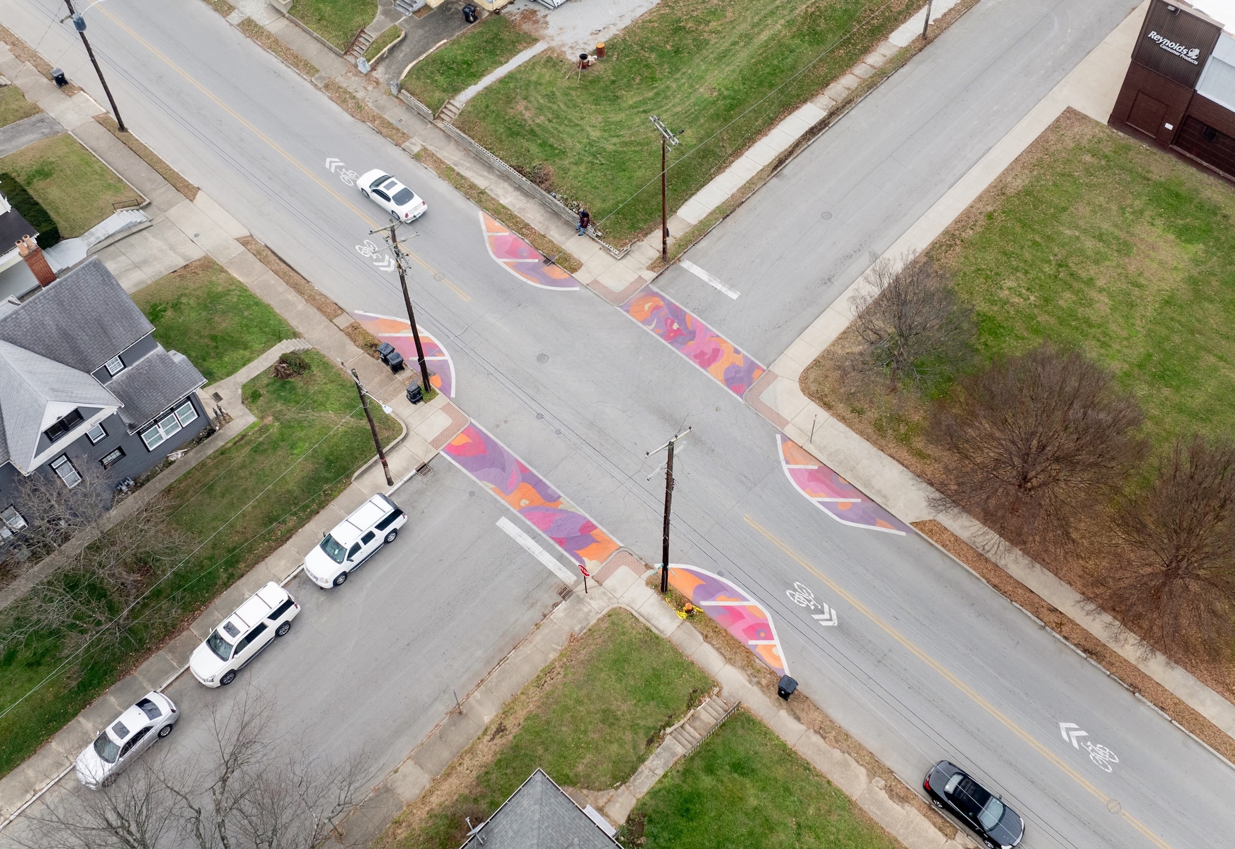 Asphalt Art Initiative before/after comparison photos of Louisville, Kentucky.