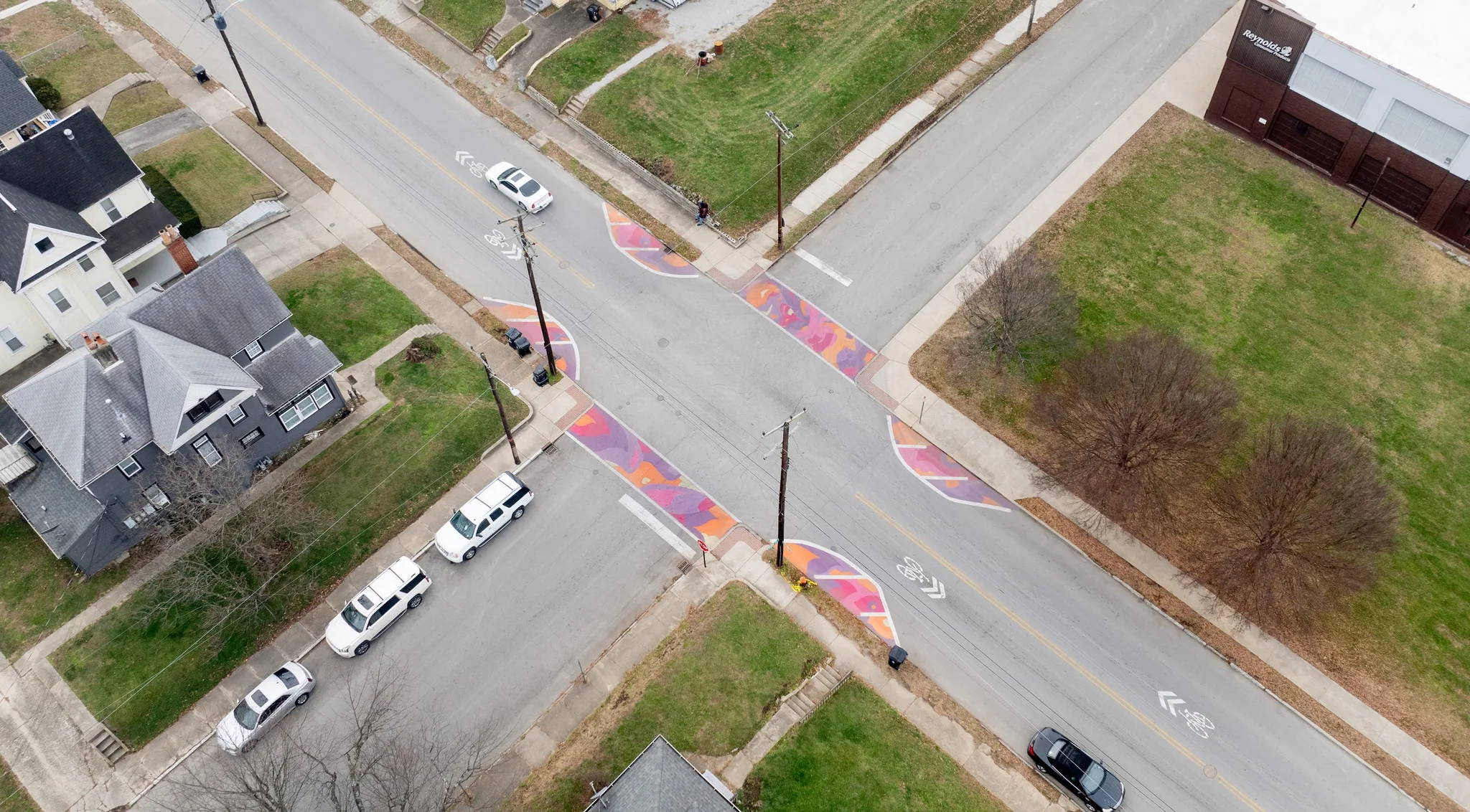 Asphalt Art Initiative before/after comparison photos of Louisville, Kentucky.