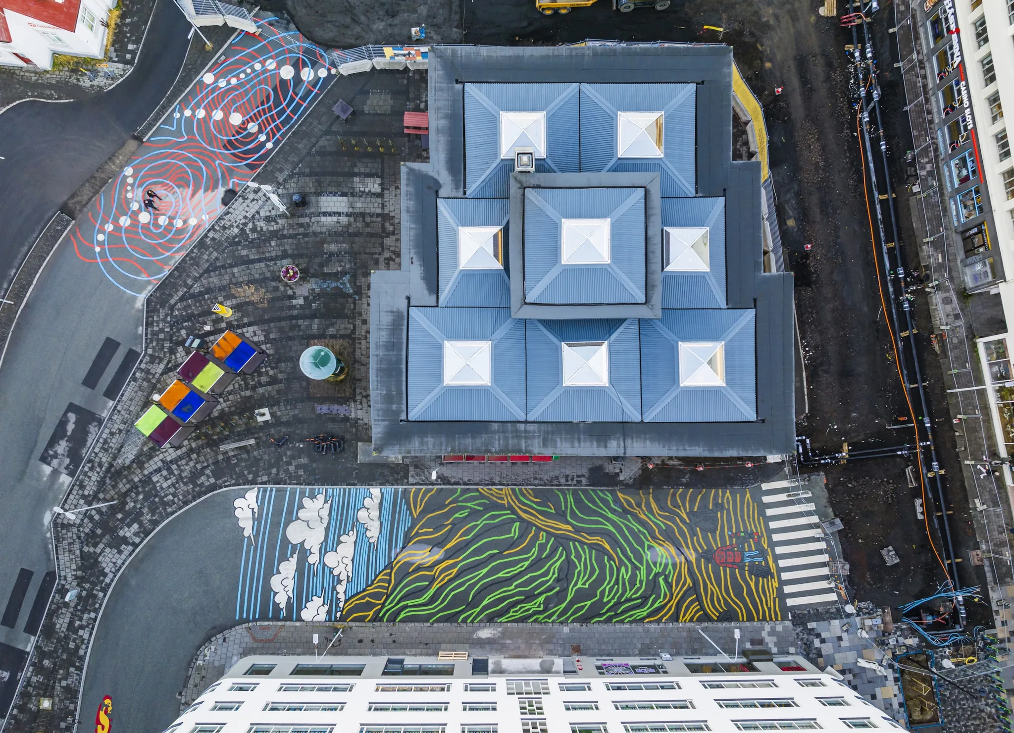 Asphalt Art Initiative before and after comparison photos in Reykjavik, Iceland.