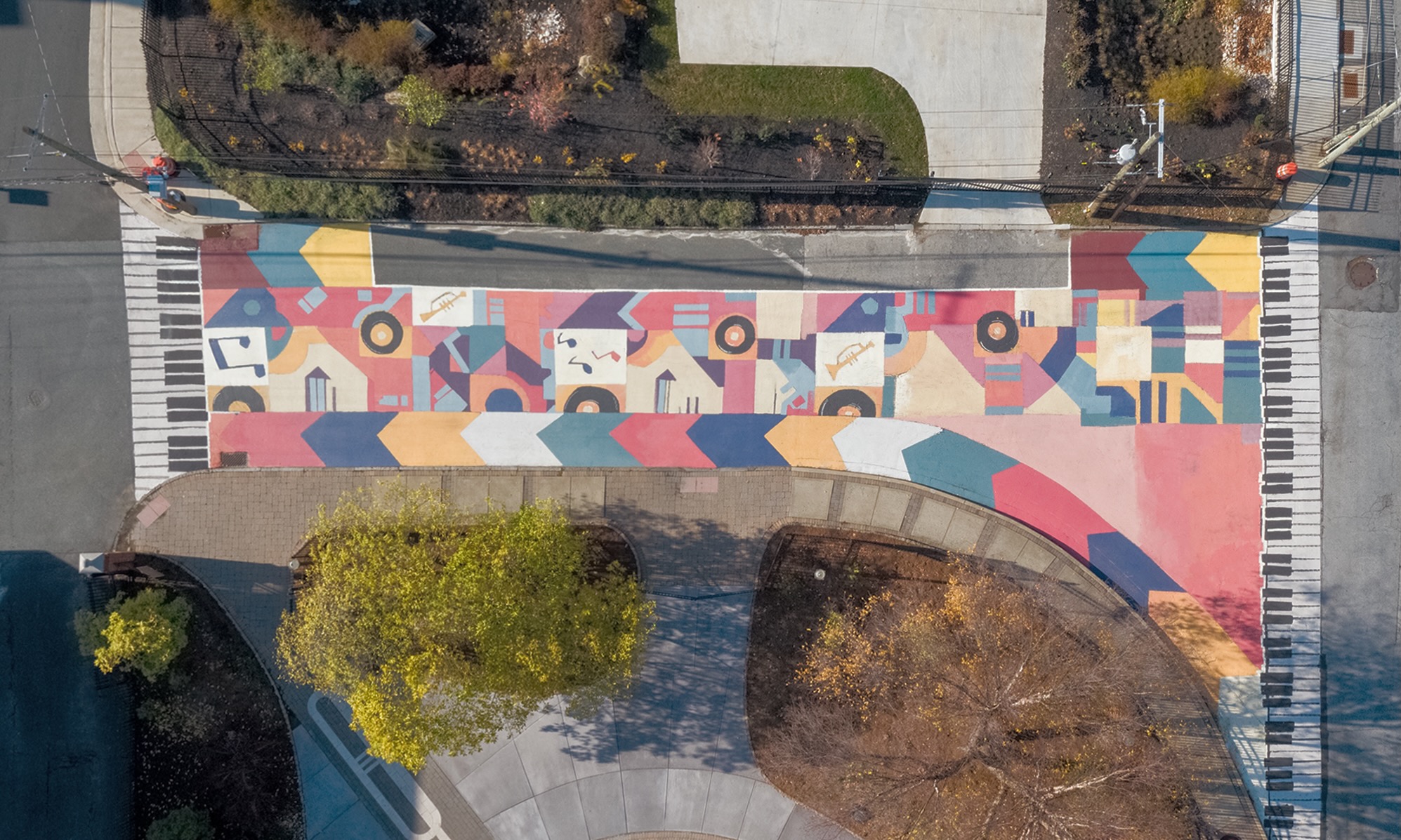 Asphalt Art Initiative before/after comparison photos of Wilmington, Delaware.