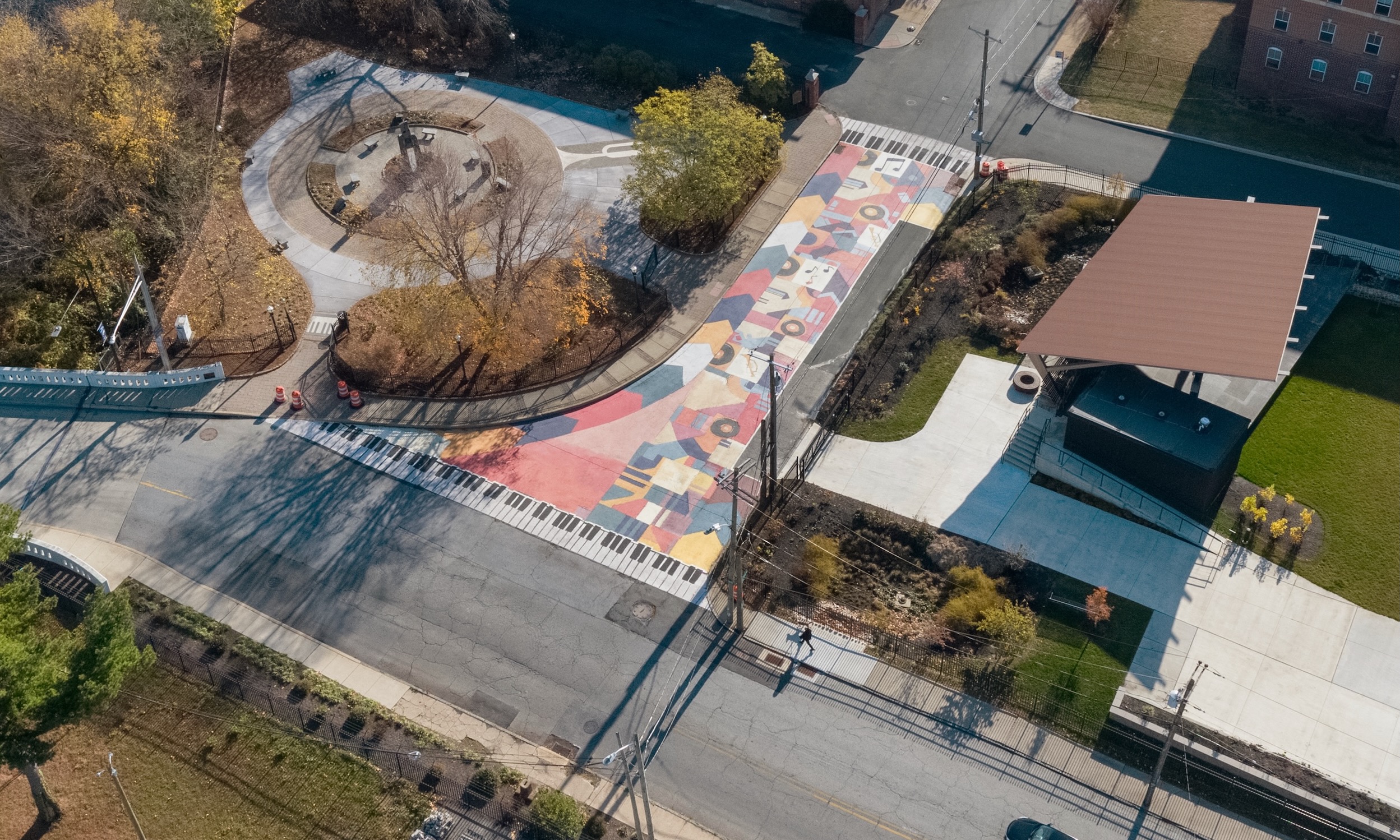Asphalt Art Initiative before/after comparison photos of Wilmington, Delaware.