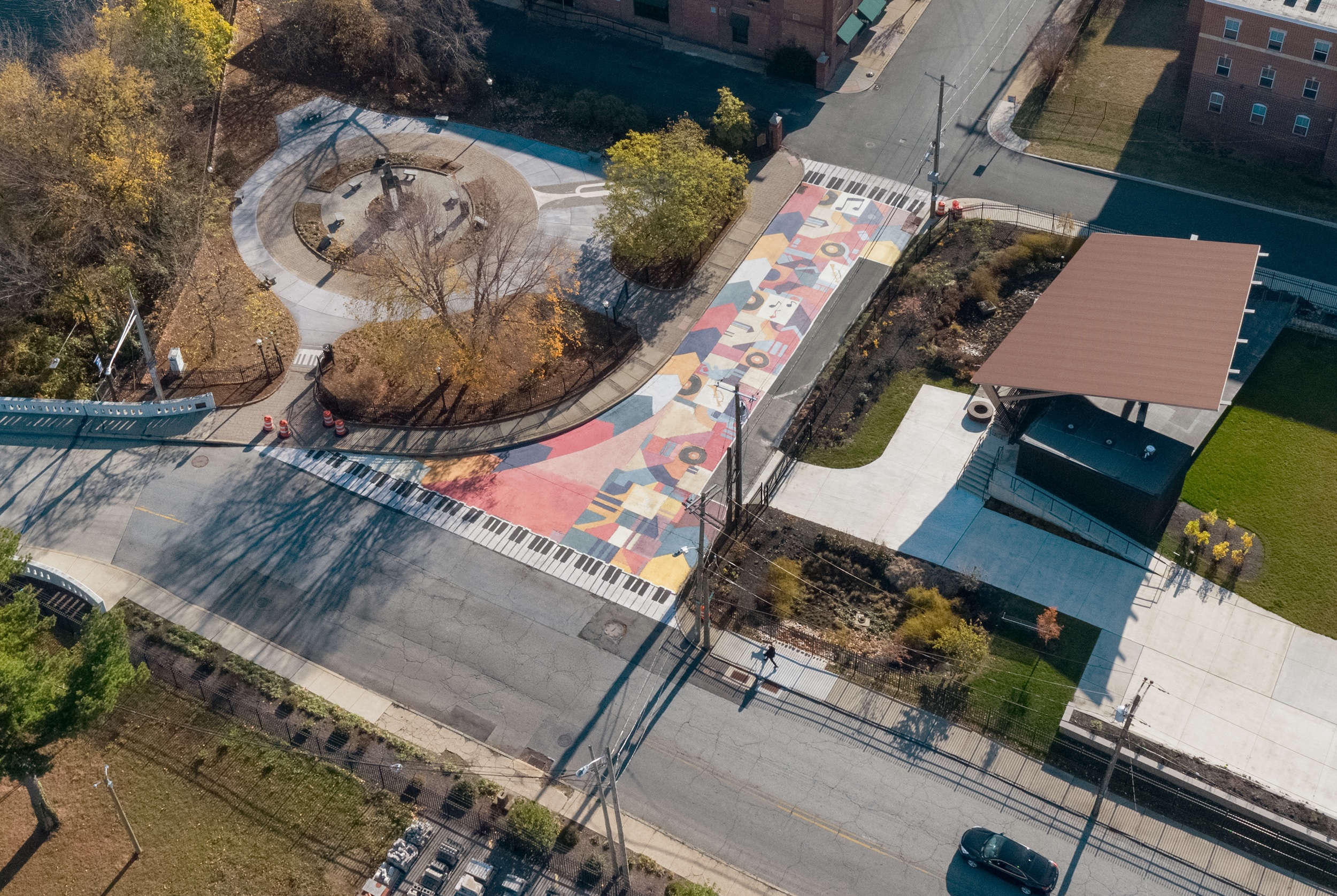 Asphalt Art Initiative before/after comparison photos of Wilmington, Delaware.