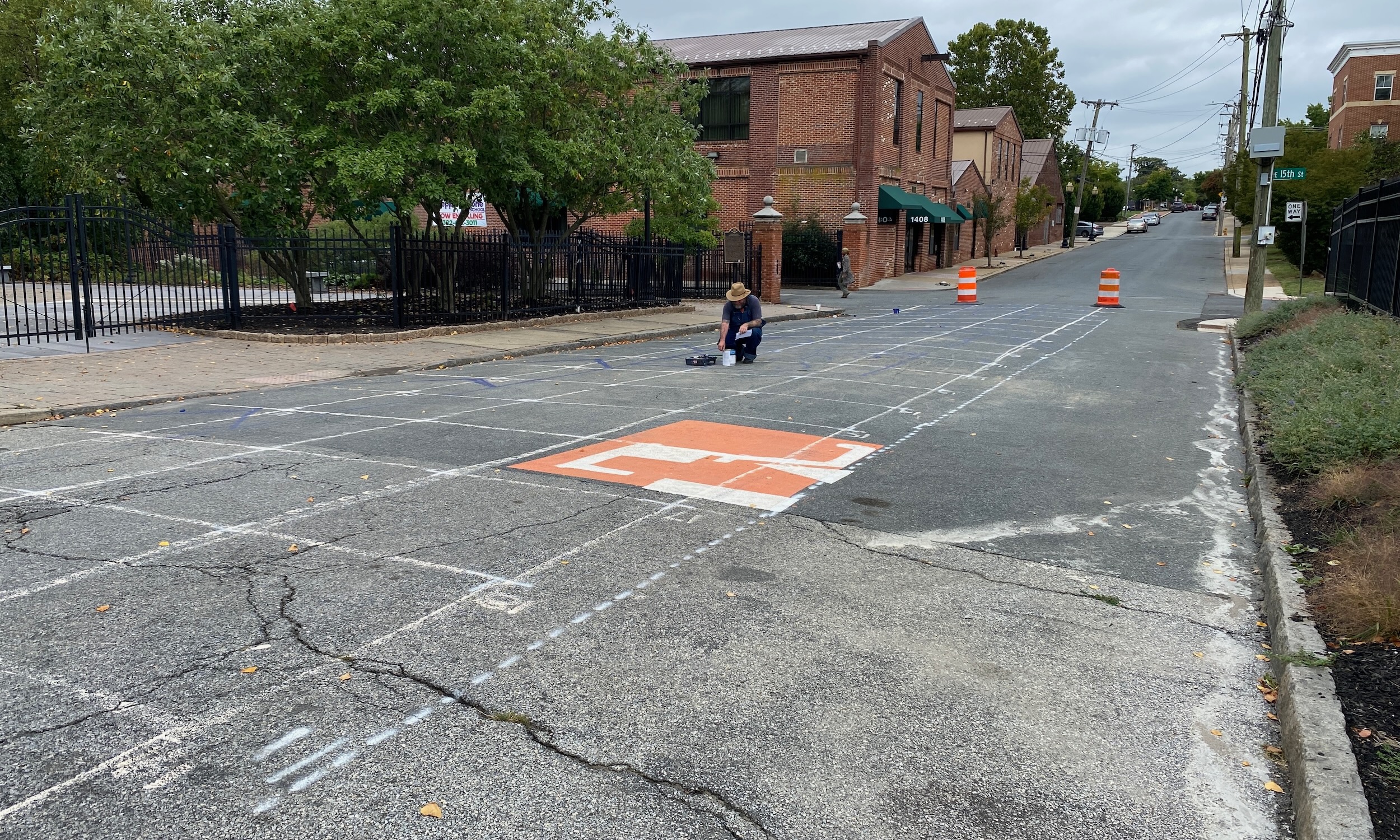 Asphalt Art Initiative before/after comparison photos of Wilmington, Delaware.