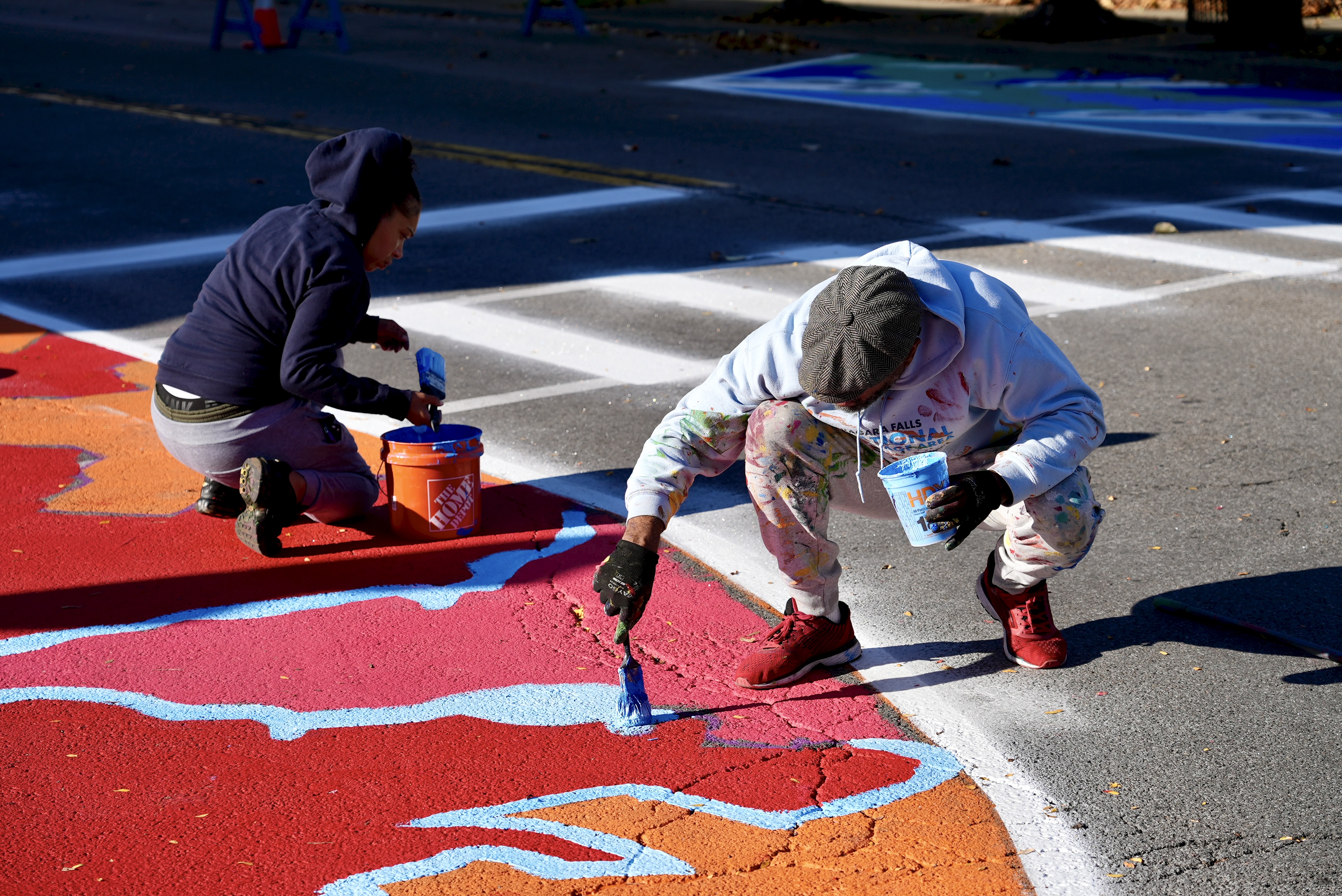 Asphalt Art before and after comparisons in Niagara Falls, NY.