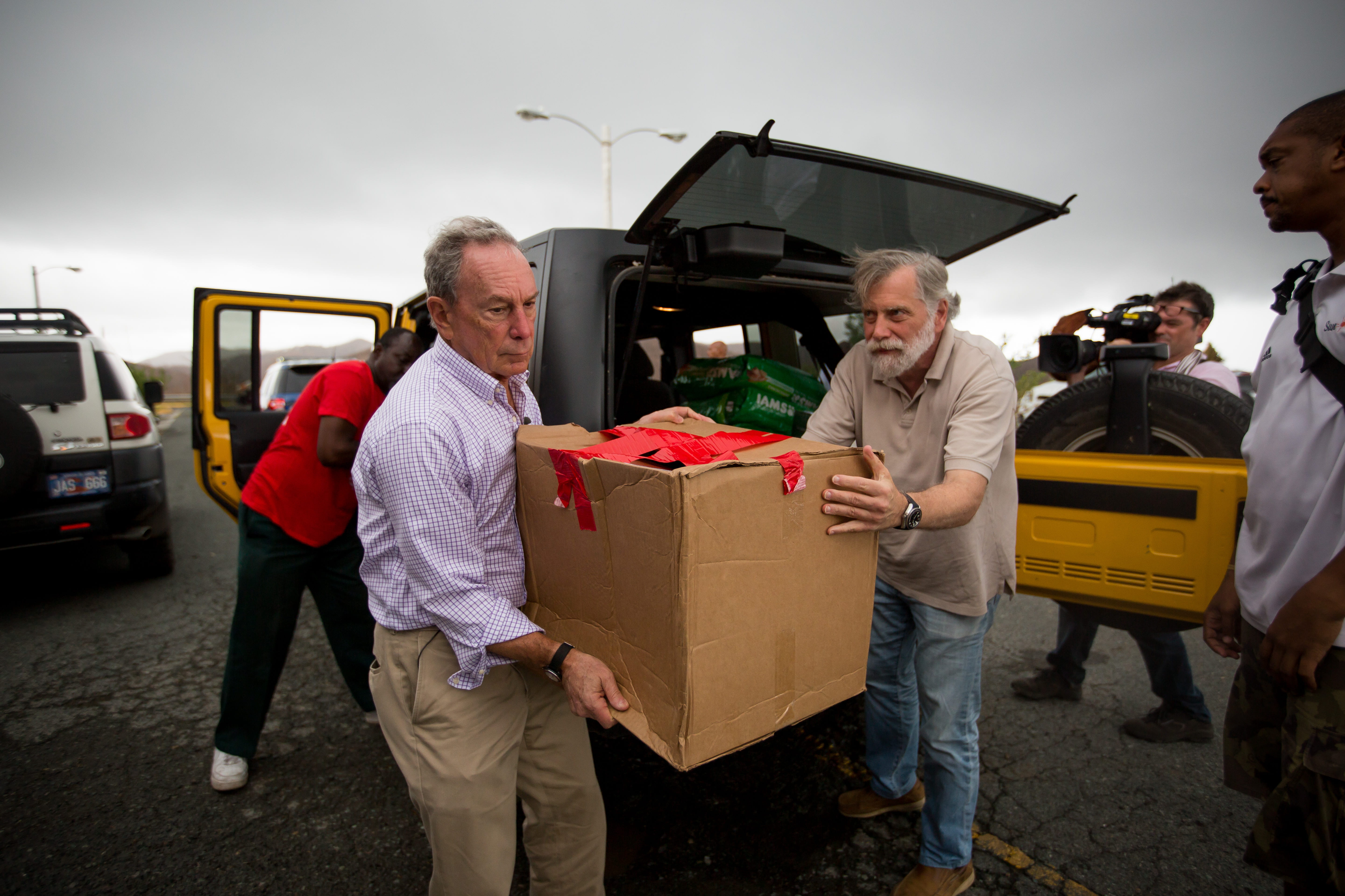 Mike Bloomberg carries boxes of supplies in the U.S. Virgin Islands following the hurricanes of 2017.