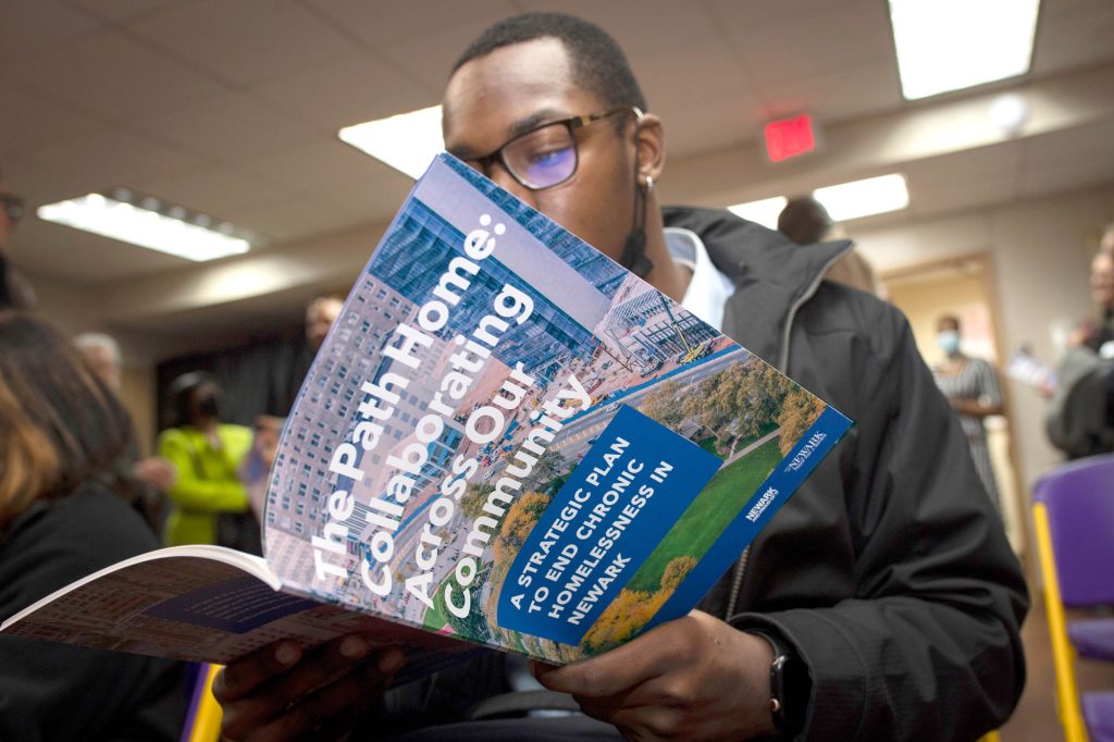 A man reading a brochure