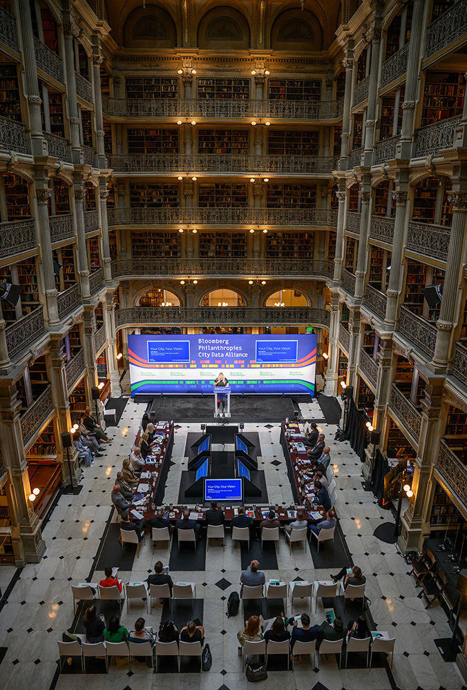 A group of 23 mayors participate in a City Data Alliance coaching session at the George Peabody Library, Johns Hopkins University.