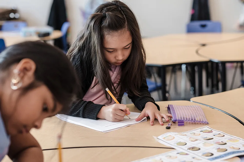 Students at Central Queens Academy Charter School engage in Summer Boost activities to improve math and reading skills.