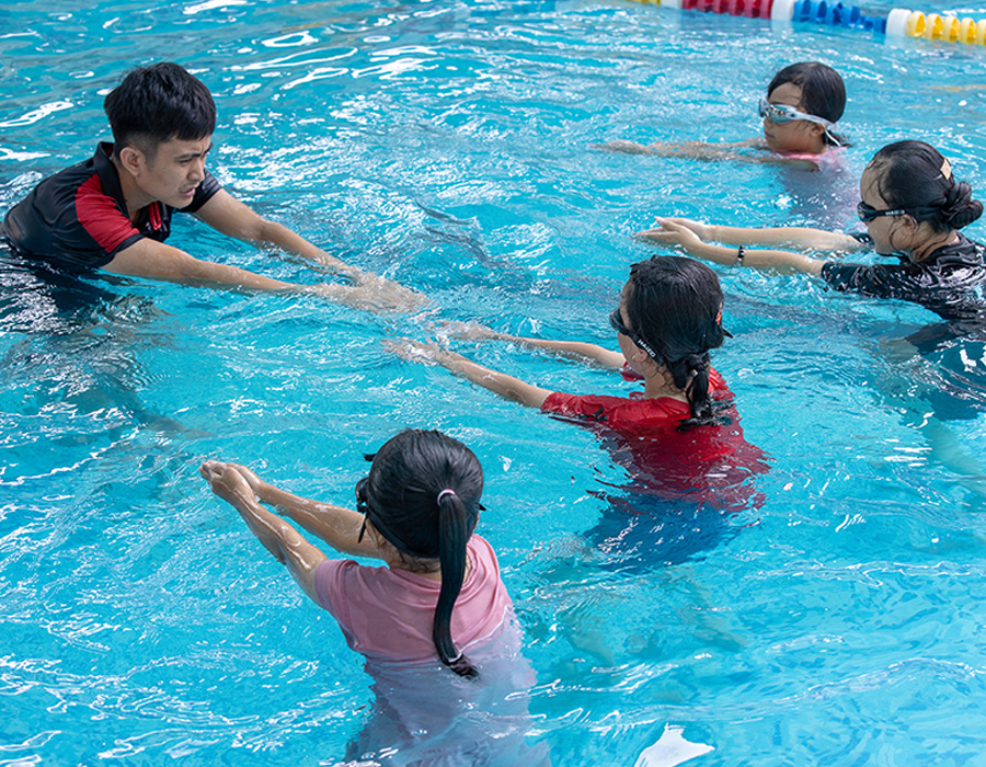Children in Vietnam participate in survival swimming lessons that were later expanded by the national government.
