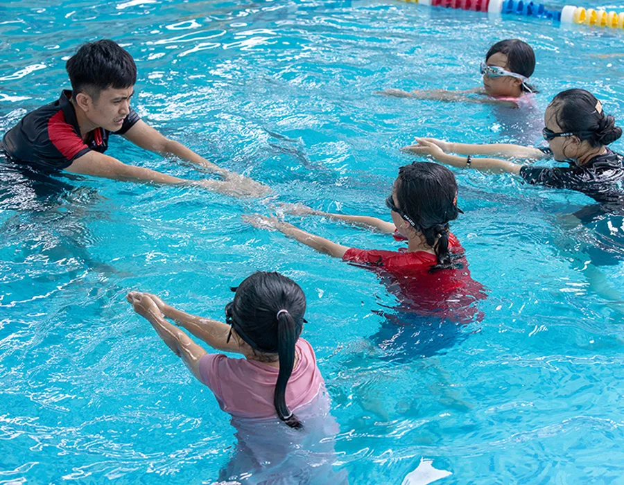 Children in Vietnam participate in survival swimming lessons that were later expanded by the national government.