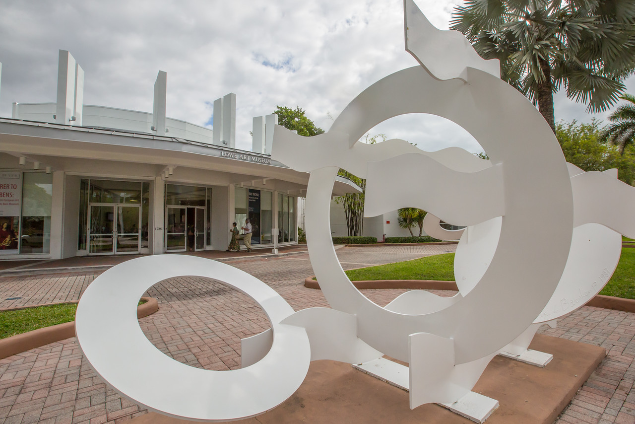Image of an abstract metal white sculpture depicting circles and waves