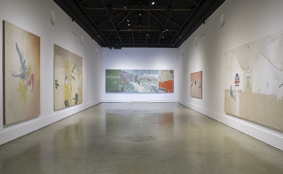 View of a room with five works by Xavier Coronel on the walls.