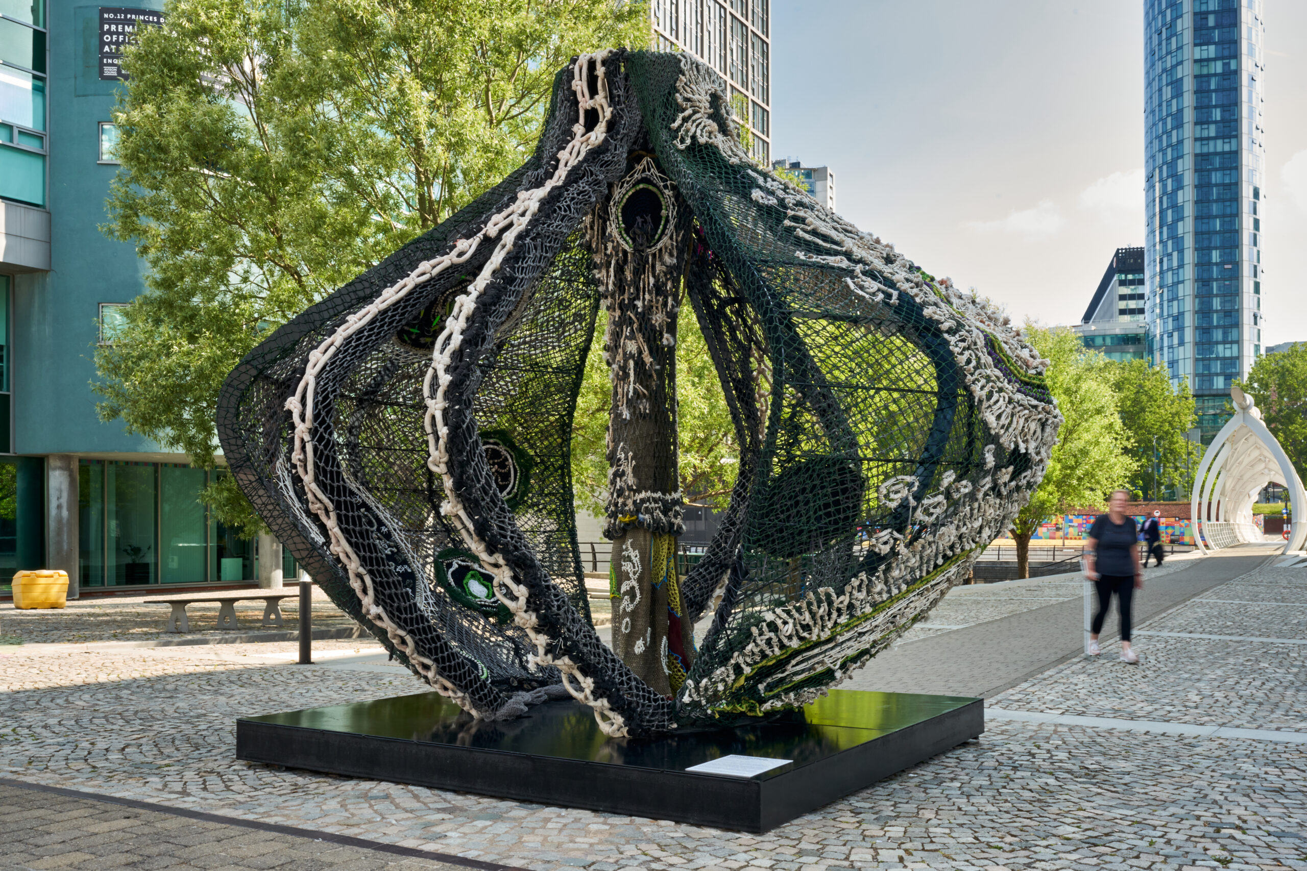 A large-scale sculpture ⁠in the shape of a vessel. The sculpture is created with steel and recycled fishing nets with hand-woven embellishment.
