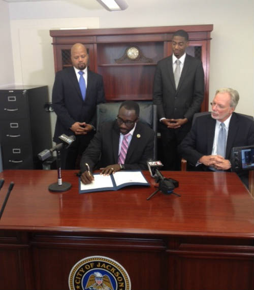 Jackson Mayor Tony Yarber signs the first-ever open data policy in the state of Mississippi.