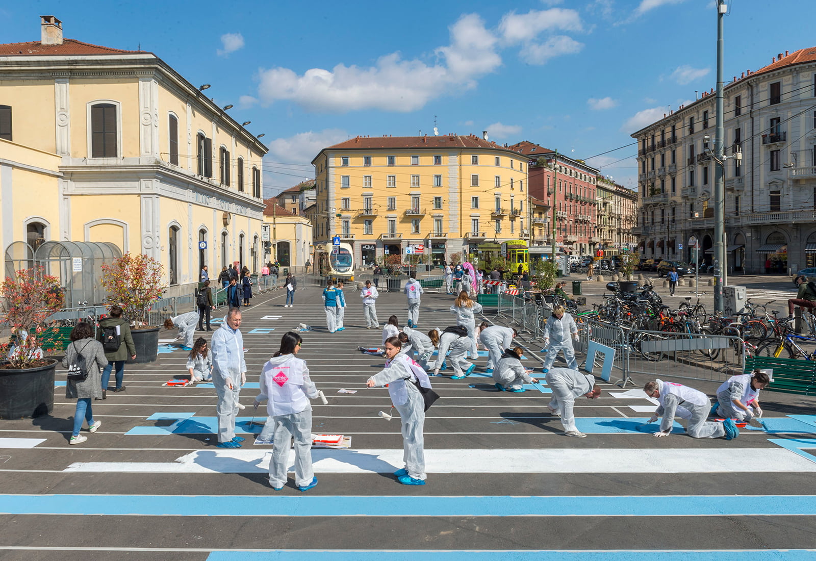 Bloomberg L.P. volunteers paint a pedestrian plaza in Milan, Italy.