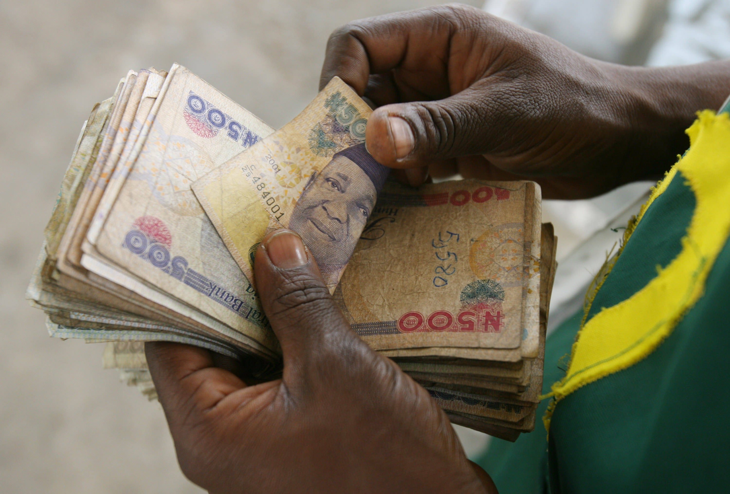 Nigeria battles to halt spiraling currency crisis and rising food