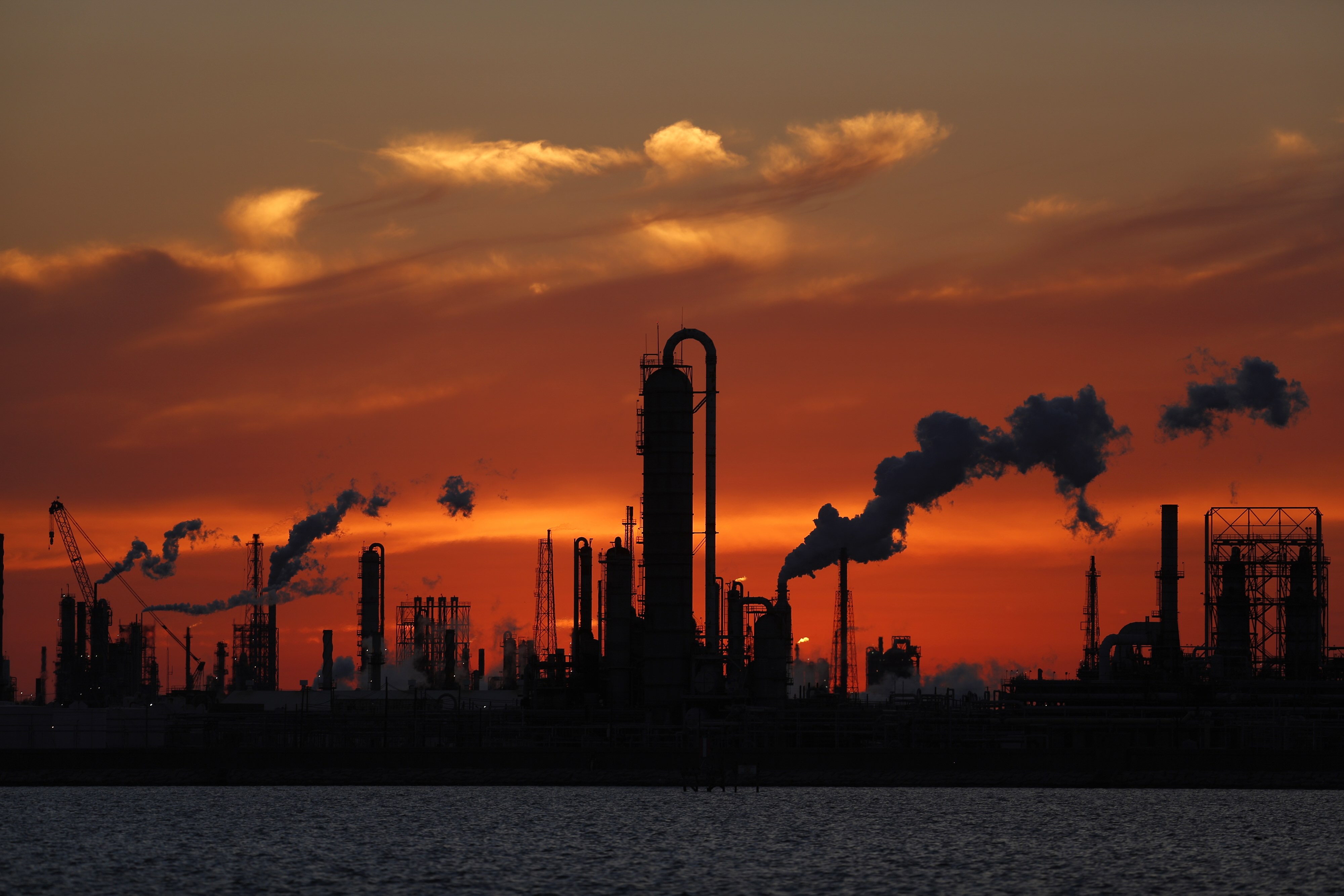 Oil refinery at sunset