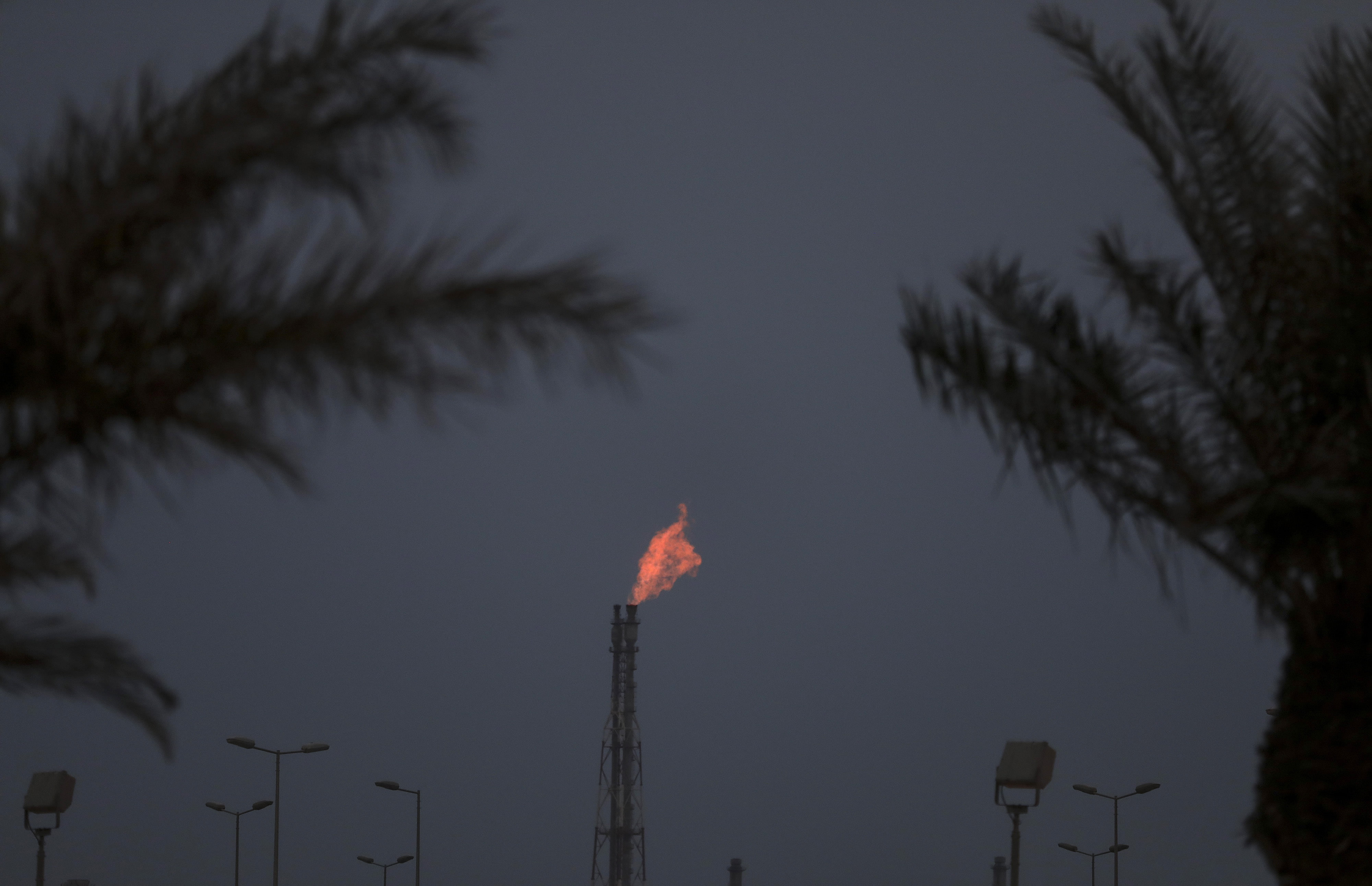 A flame burns from a chimney at a phosphate processing plant in Saudi Arabia