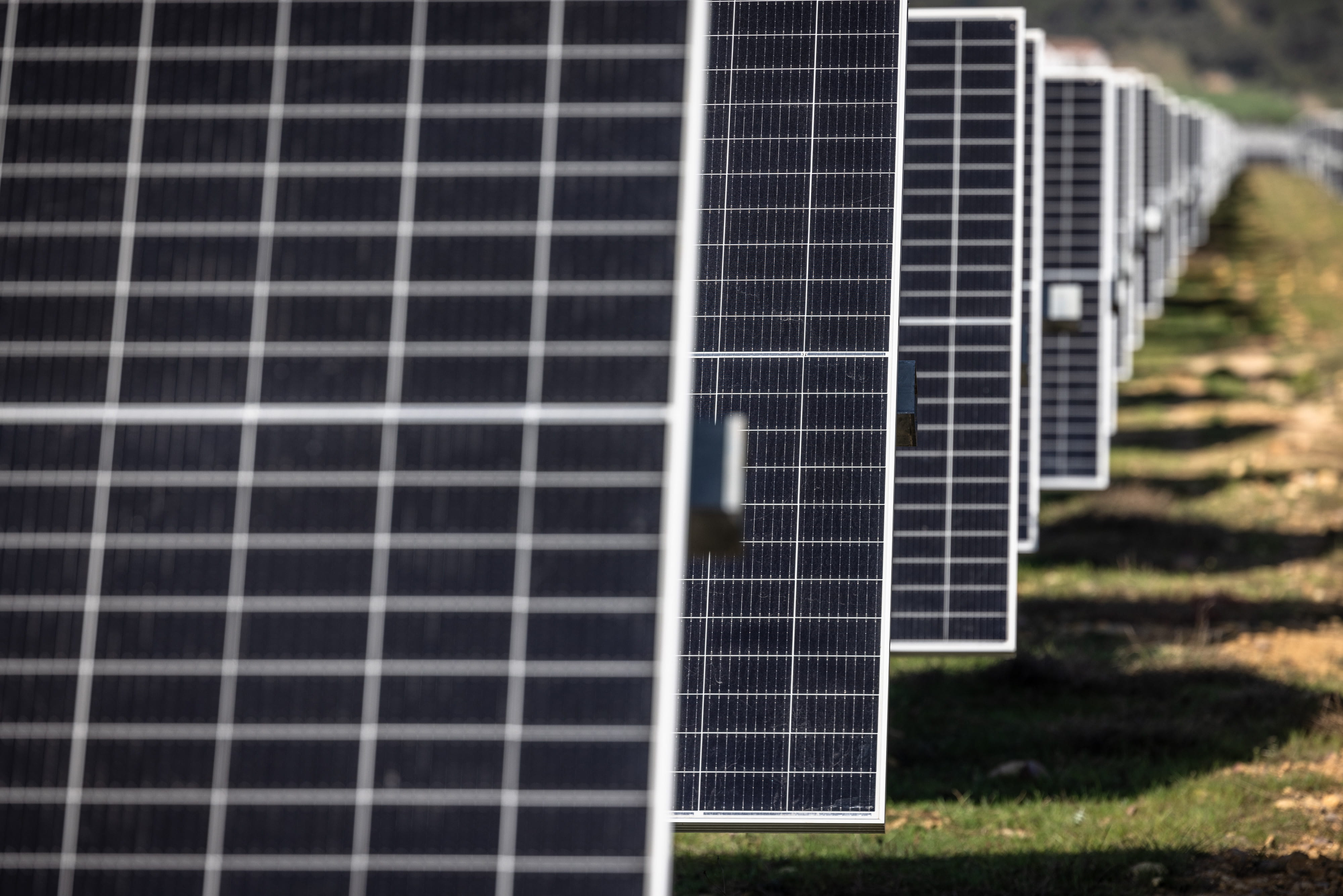 Rows of photovoltaic panels at a solar park.