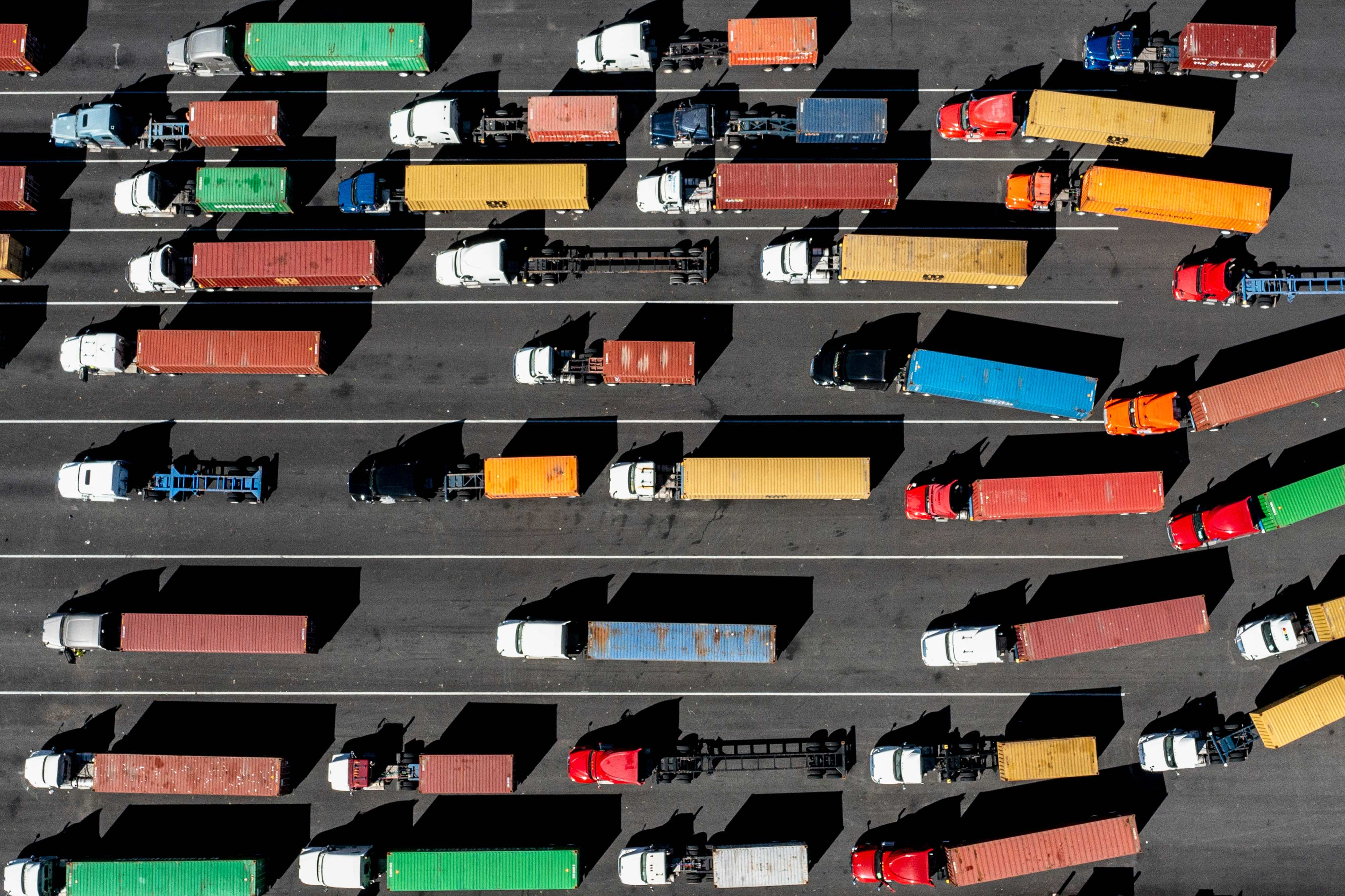 Supply chain aerial of trucks carrying containers