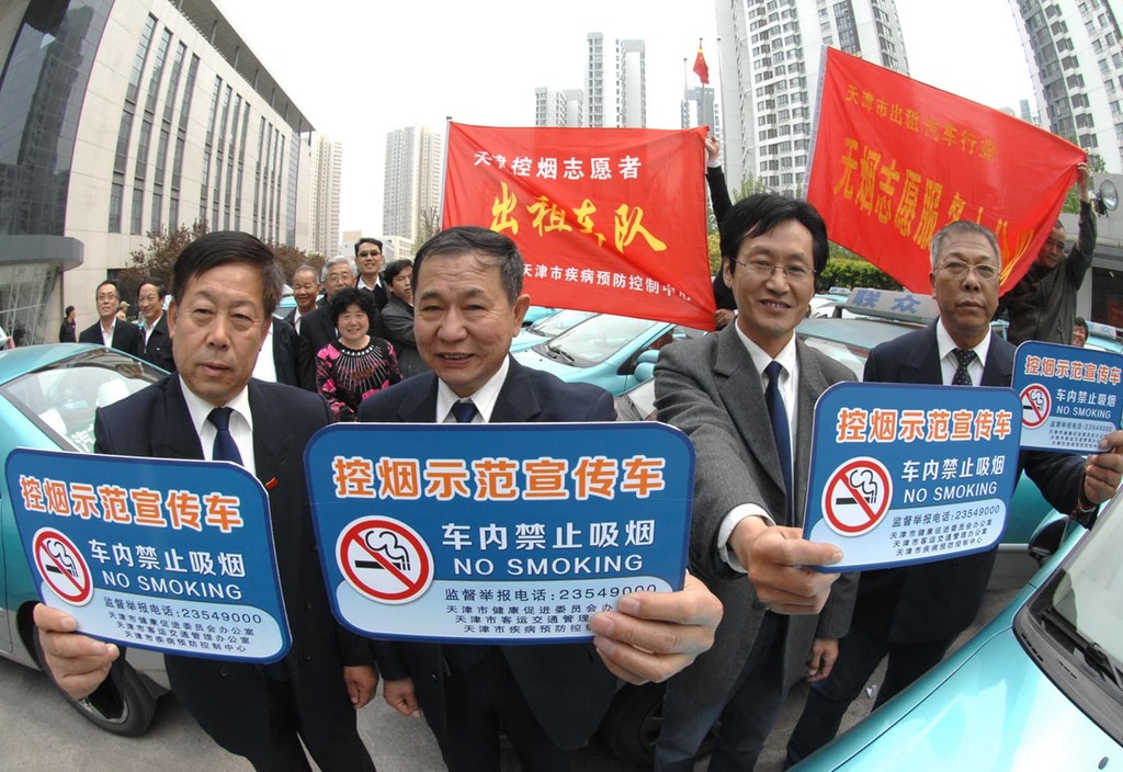 In China, taxi drivers proudly display their no smoking signs.