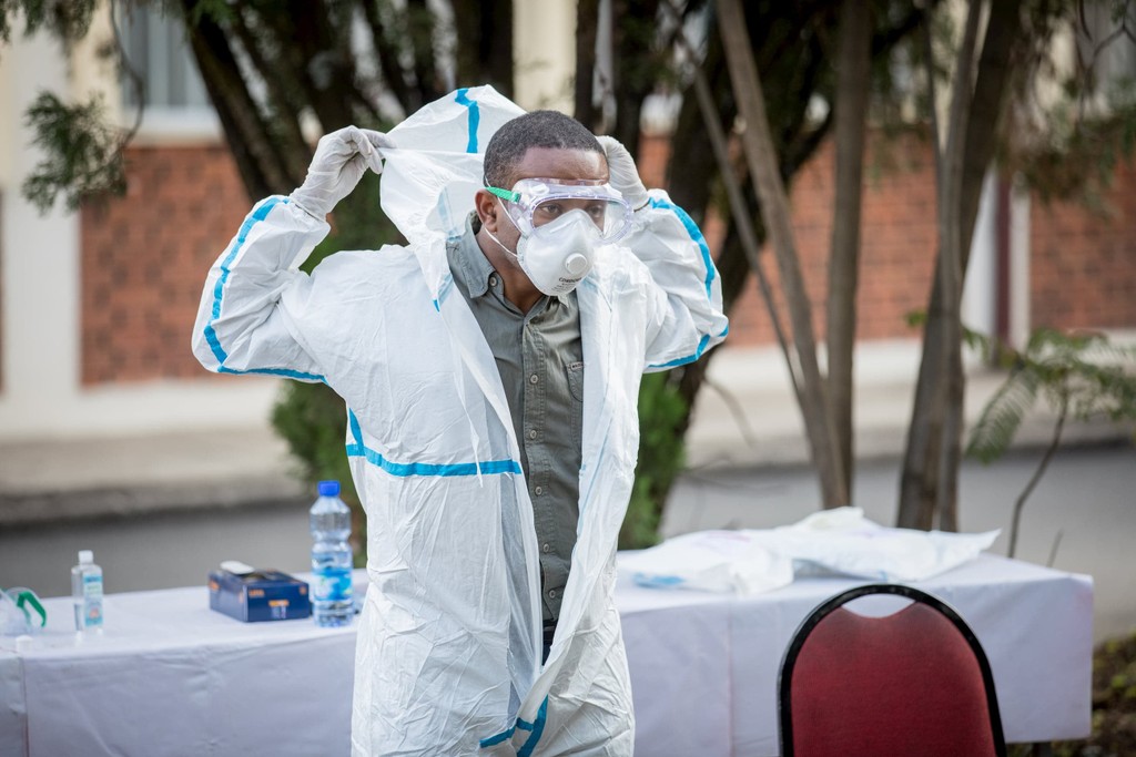 For the PPE training, trainees in Addis Ababa, Ethiopia are putting on PPE equipment.