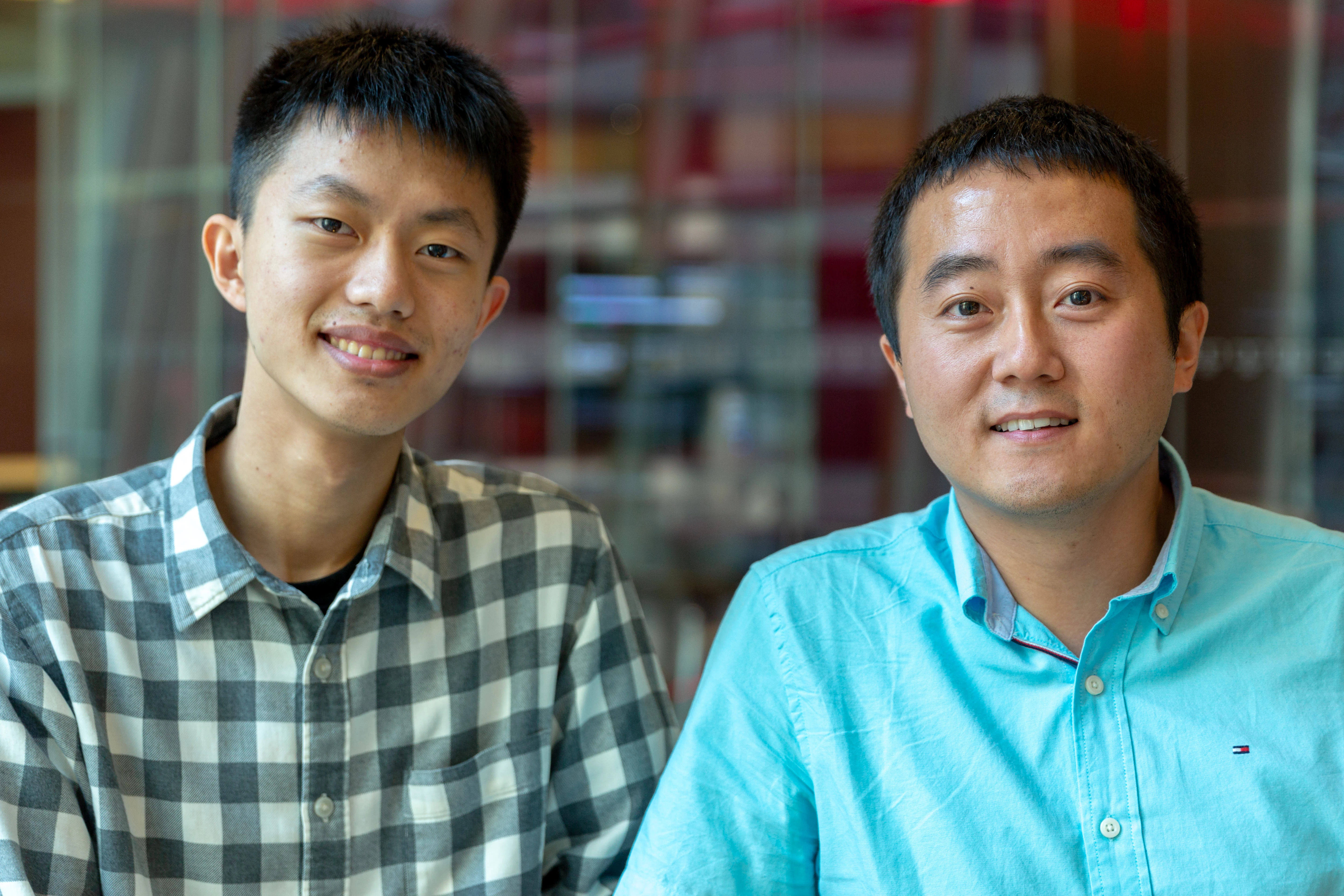 Bloomberg Ph.D. Fellow Huazheng Wang with his advisor, Professor Hongning Wang (Photographer: Lori Hoffman/Bloomberg)