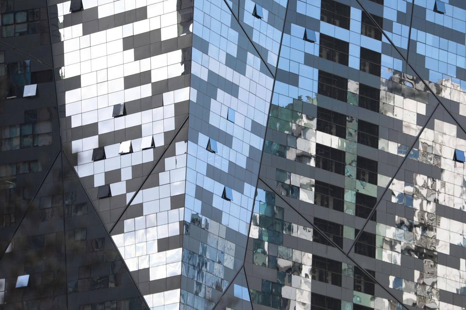 The sky is reflected in the glass windows