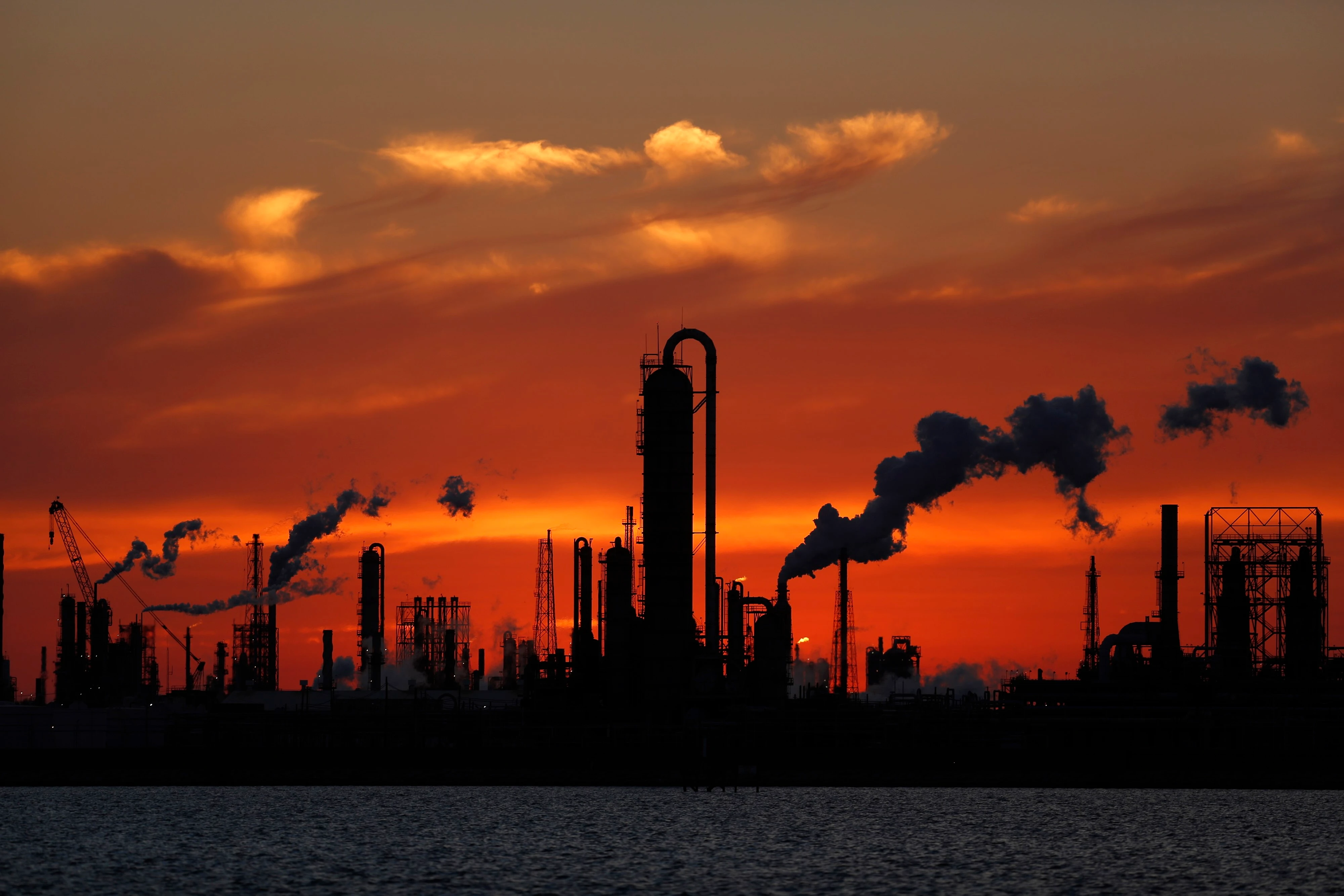 Oil refinery at sunset